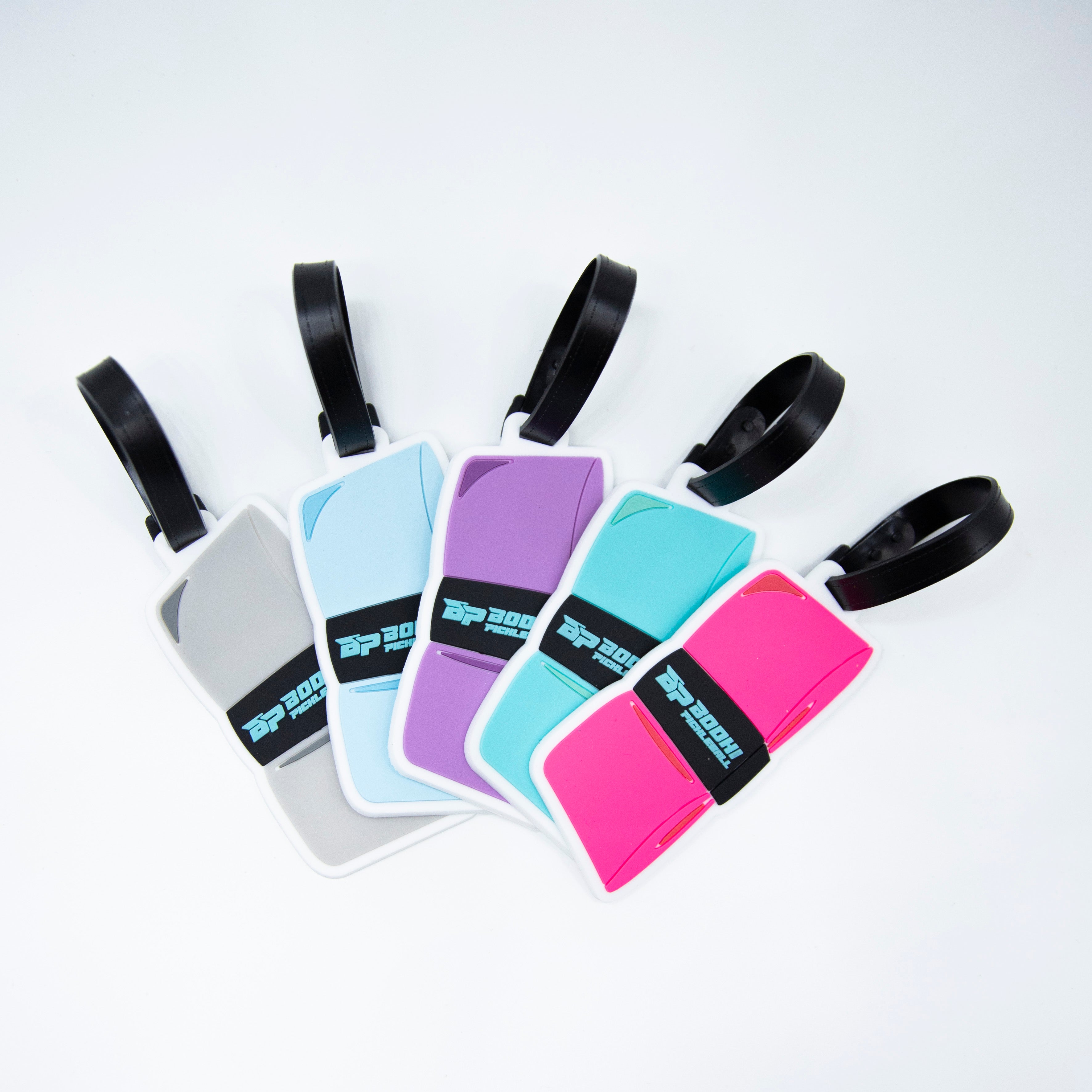Five colorful luggage tags with black straps.