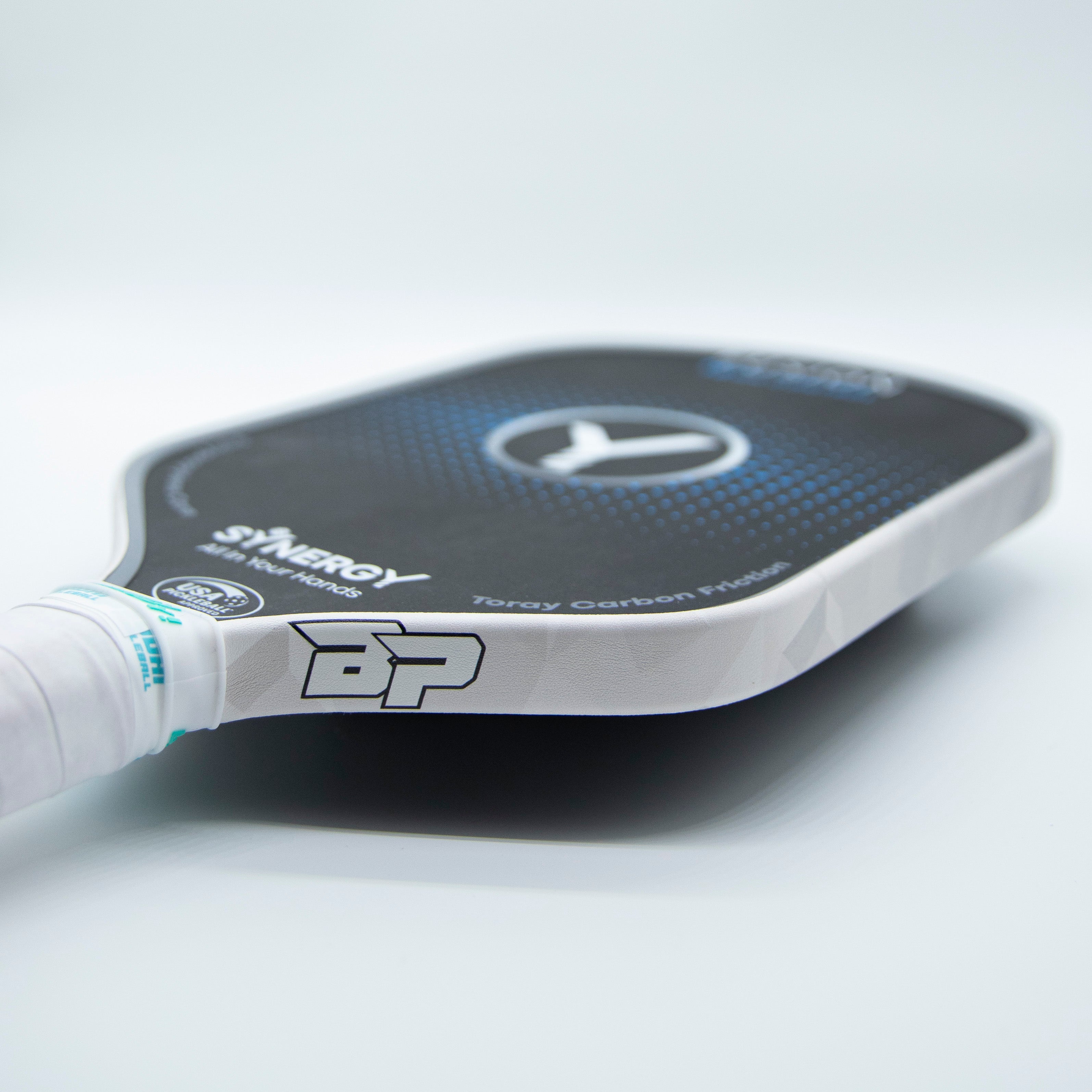 Black and white pickleball paddle with a white handle.