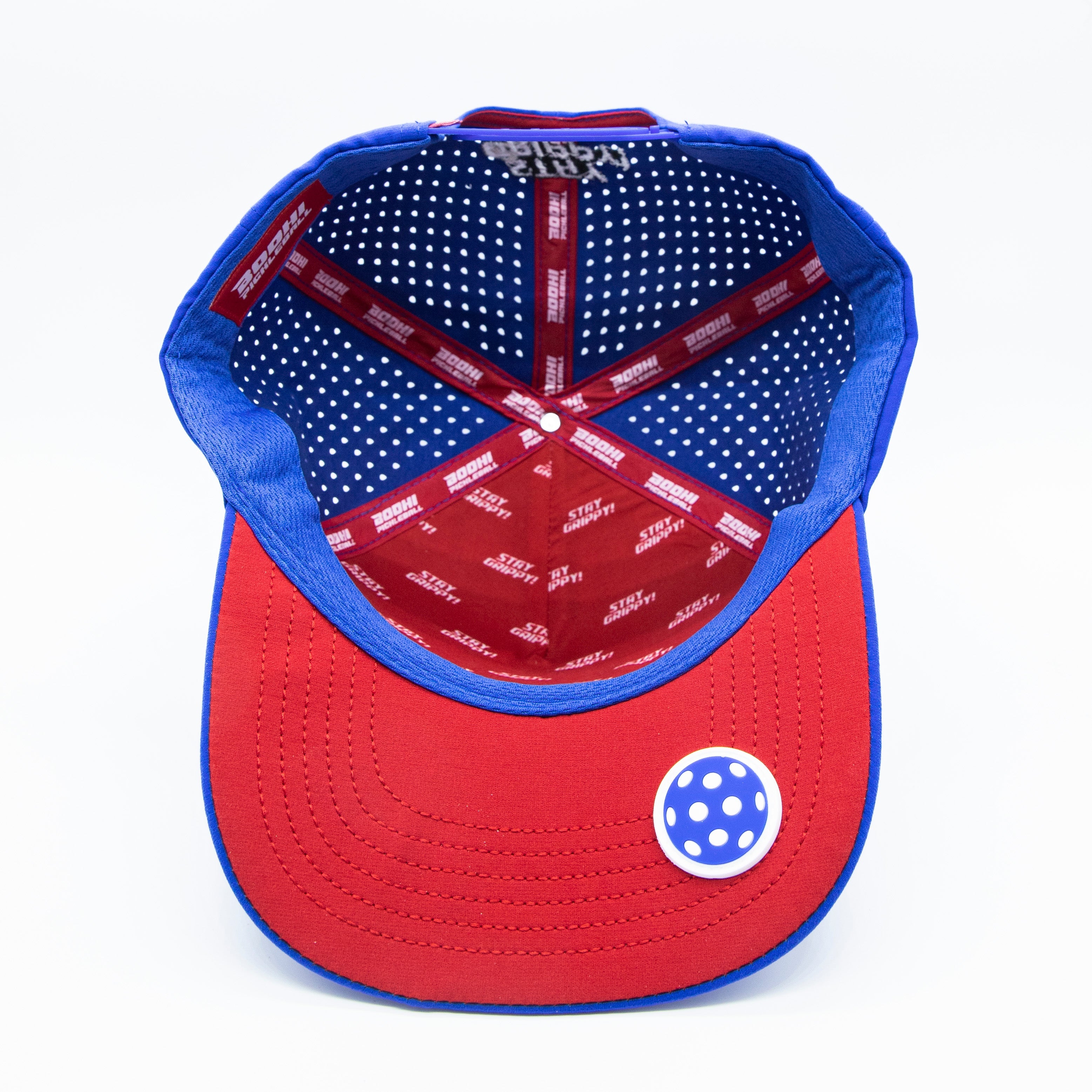 Red and blue baseball cap with polka dots on the inside.