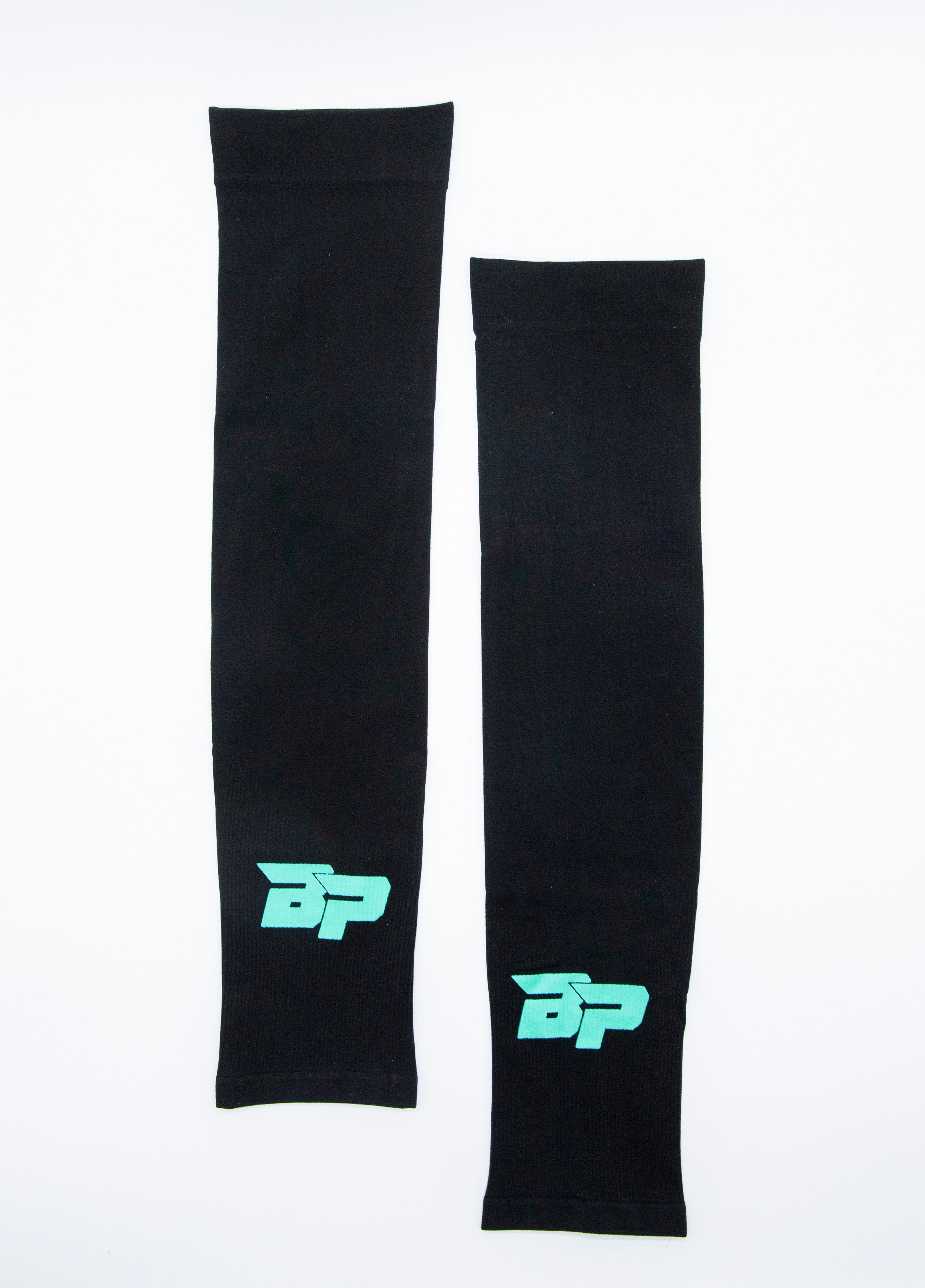 Two black performance arm sleeves by Bodhi Pickleball, one longer, each with a teal BP logo, on a white background.