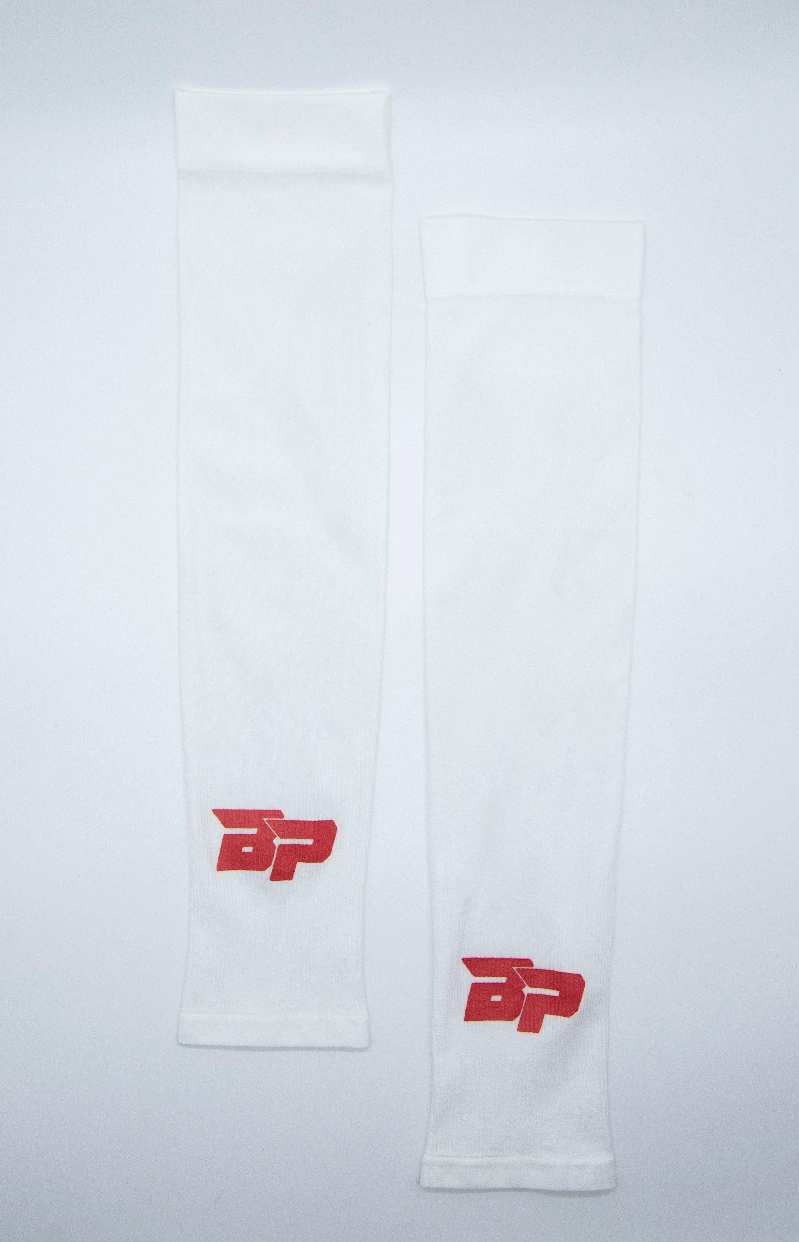 Two white leg sleeves with a red logo on a white background.