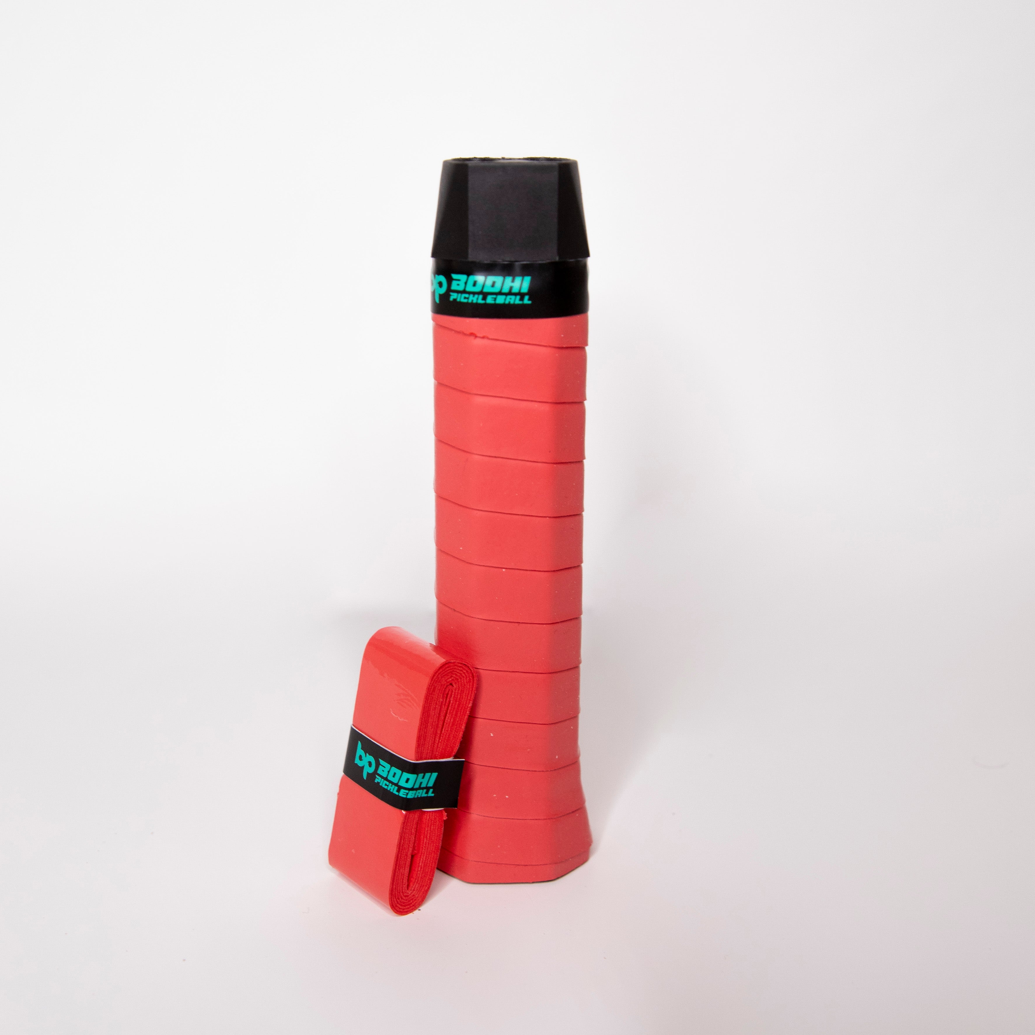 A red Bohdi pickleball grip with a black handle.