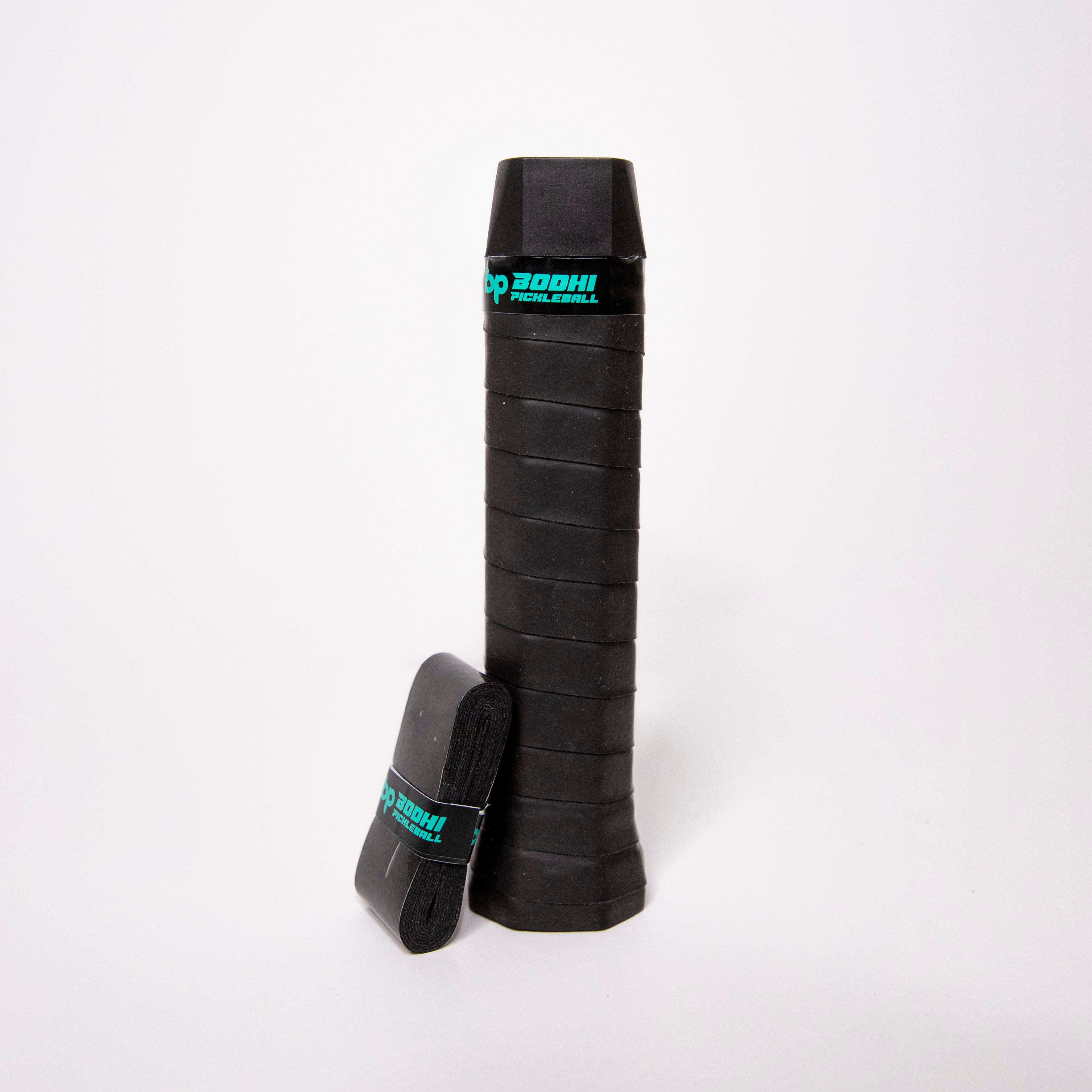 Black pickleball racket grip and replacement tape.