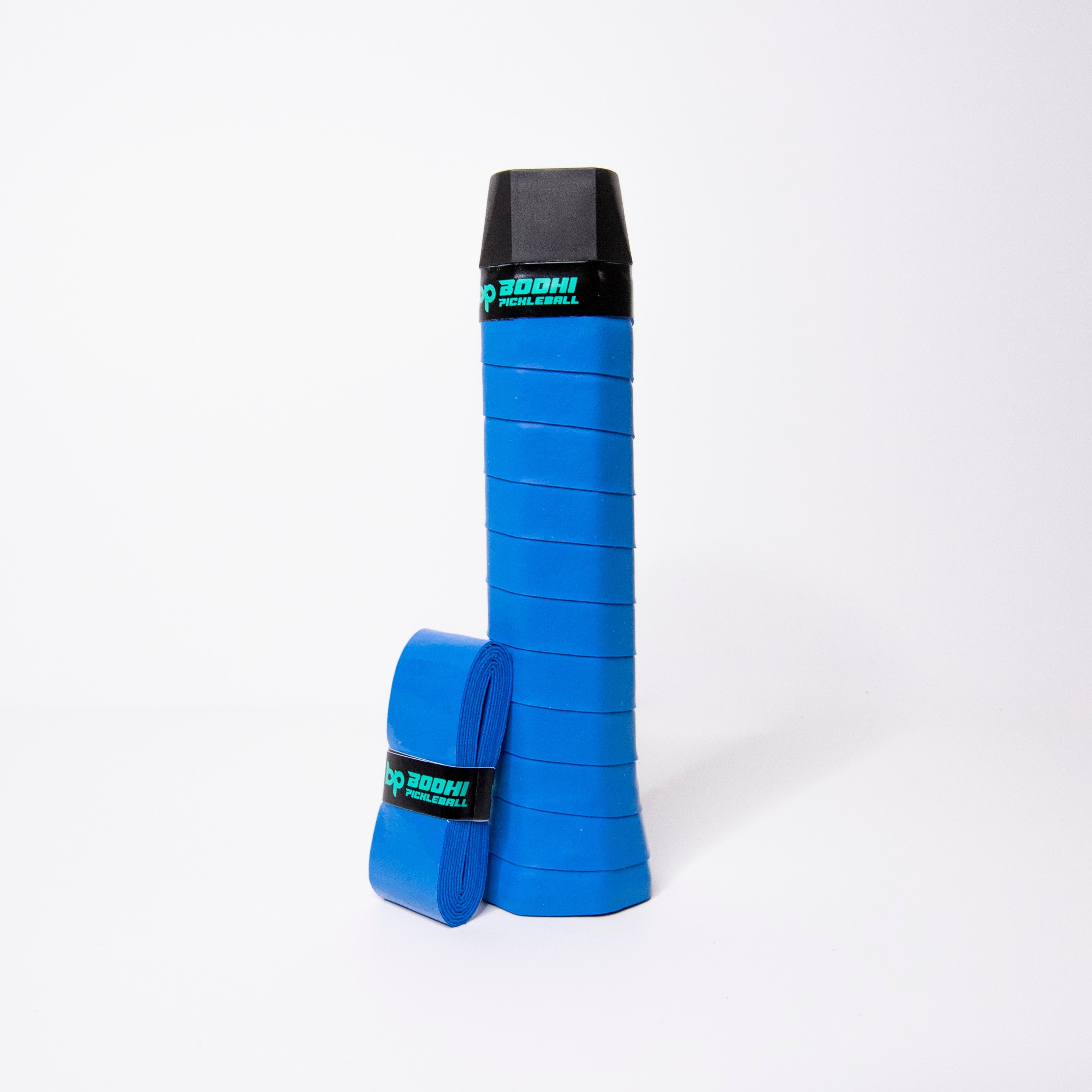 A blue pickleball paddle grip and roll of blue grip tape against a white background.