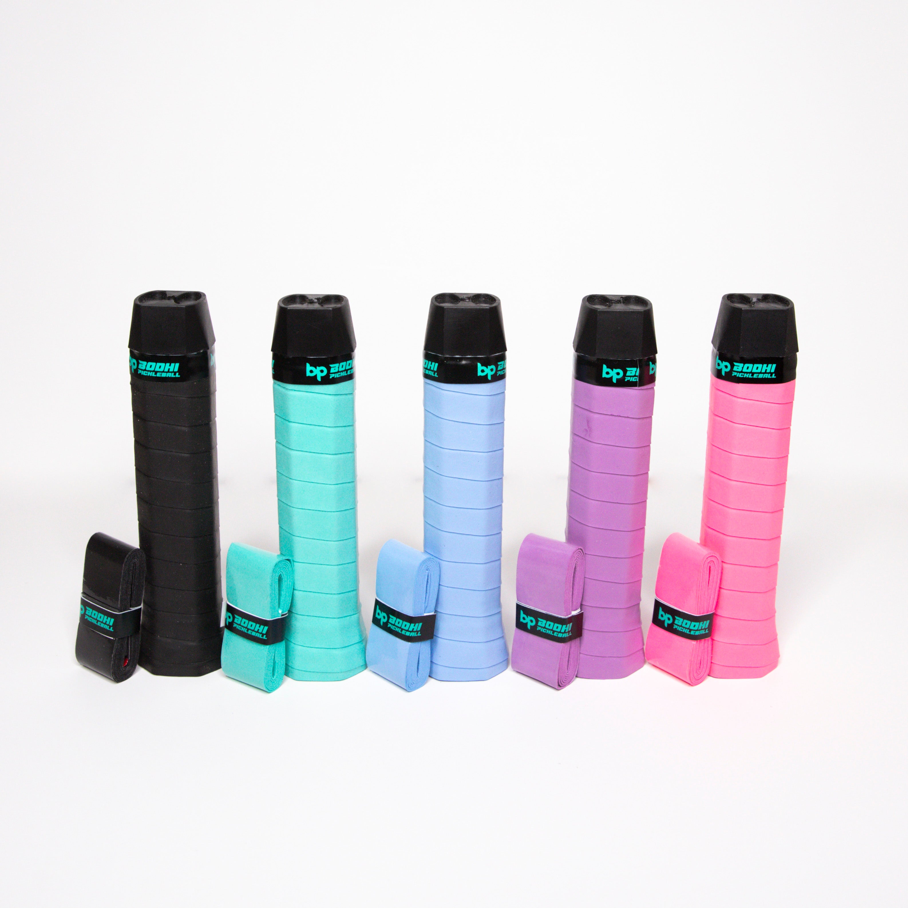 Five colorful pickleball paddle grips with overgrips on a white background.