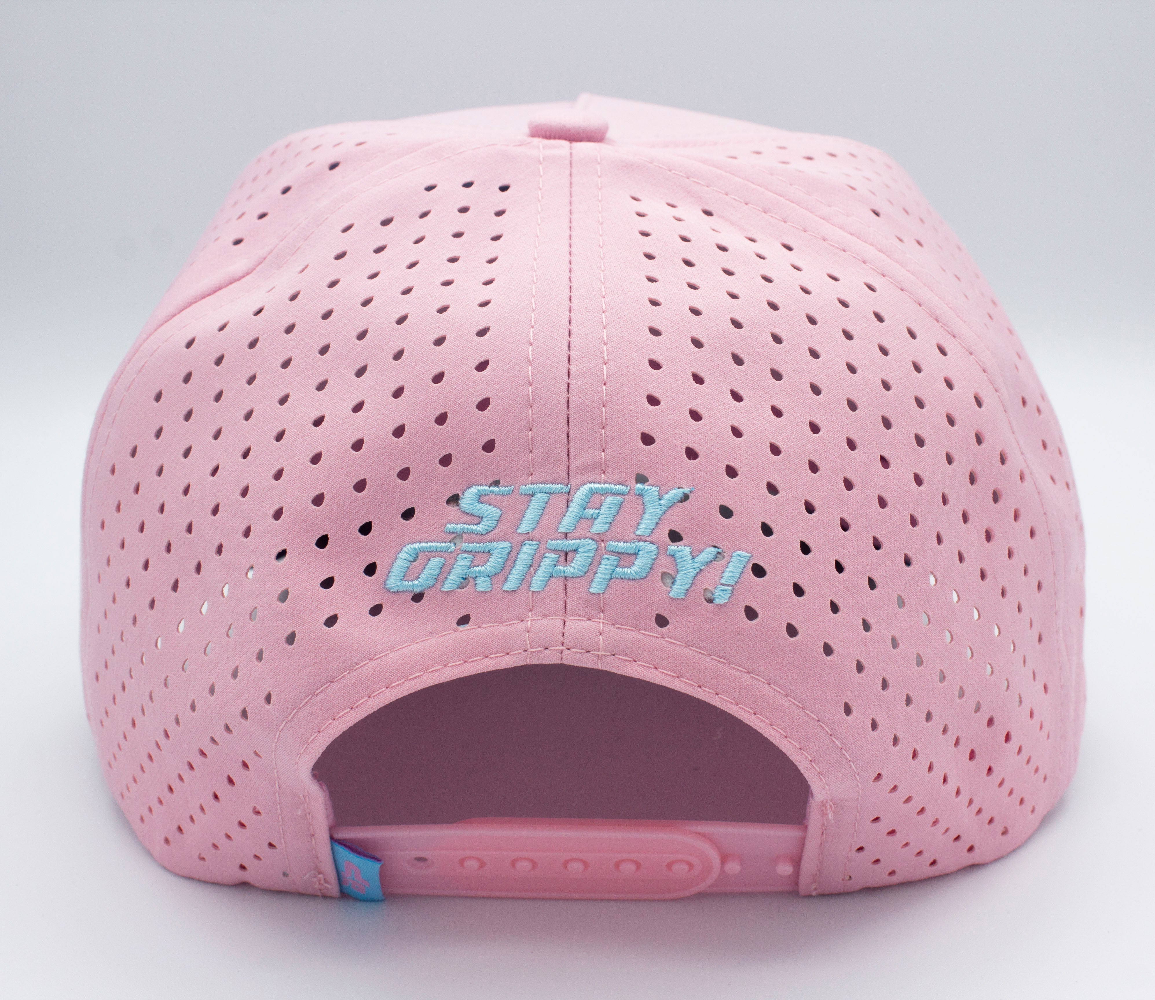 Back of a pink perforated baseball cap with light blue embroidery.