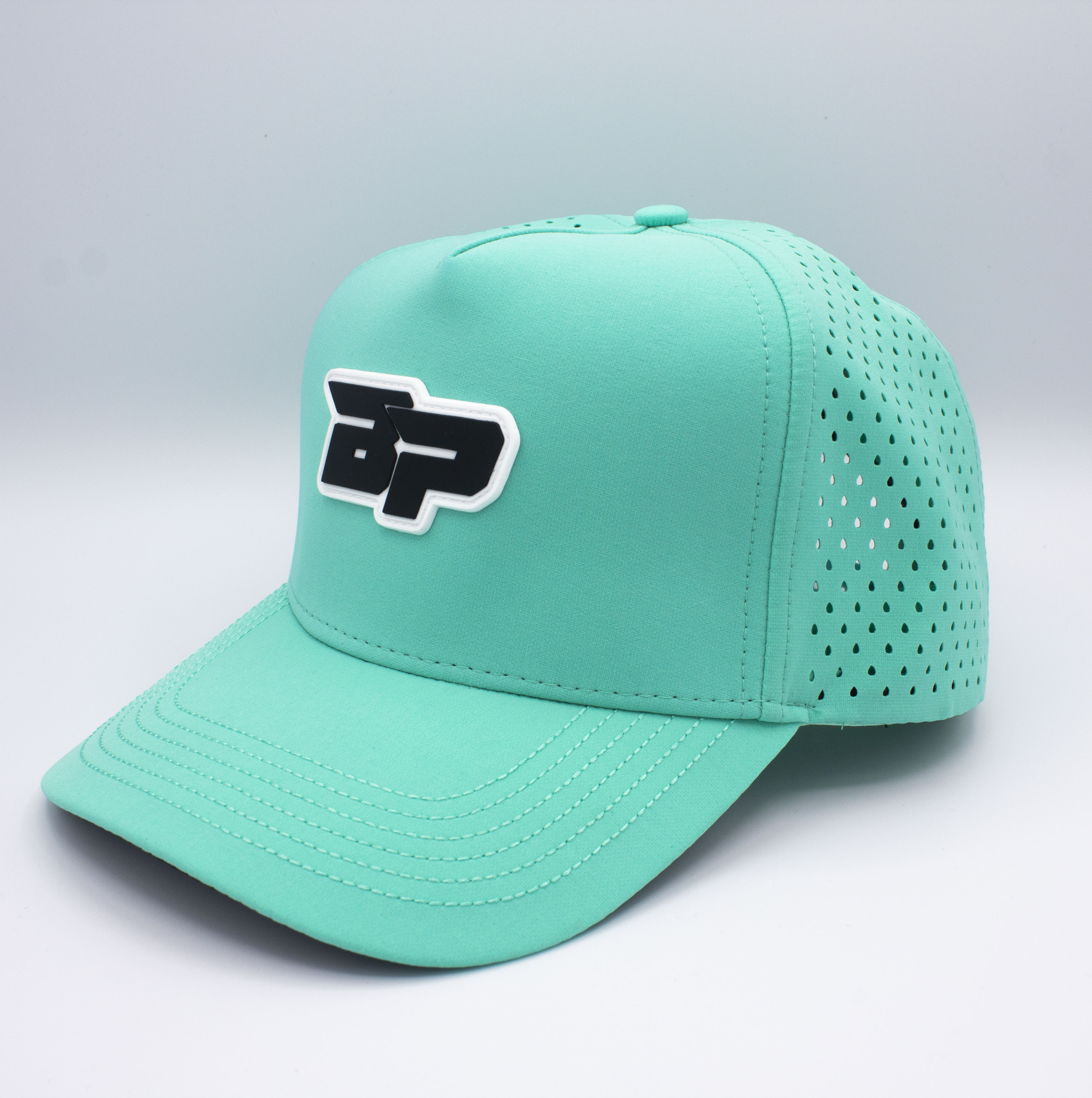 Turquoise baseball cap with black logo.