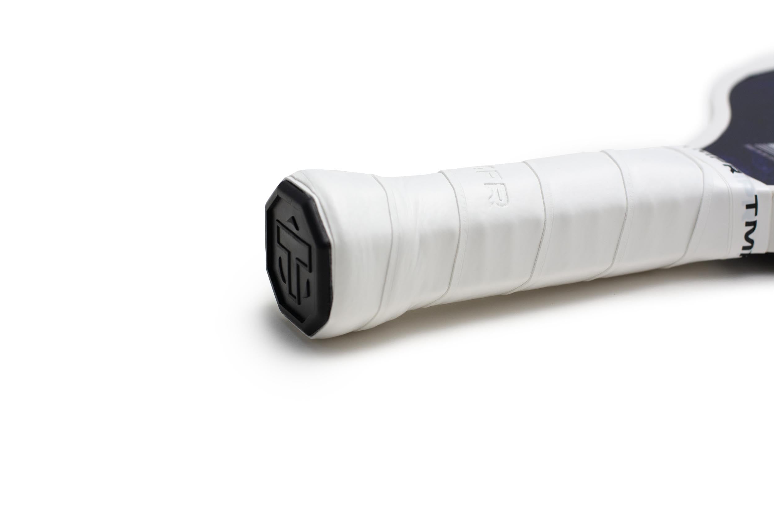 White wrapped handle of a pickleball paddle by TMPR Sports, with a black butt cap featuring a stylized T logo and a dark paddle face.