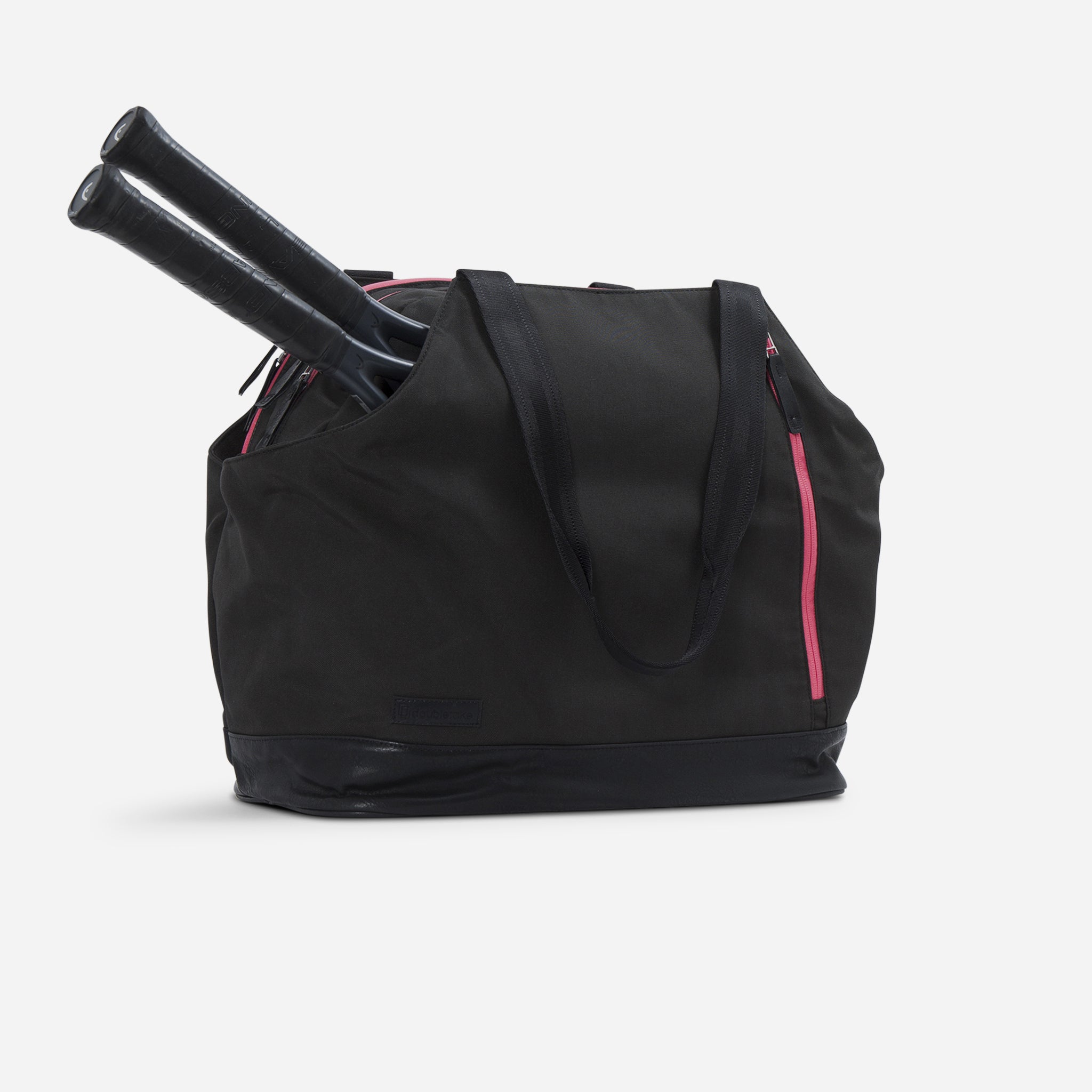 Black tennis duffel bag holding two racquets by Doubletake, with pink zippers and a subtle front logo.