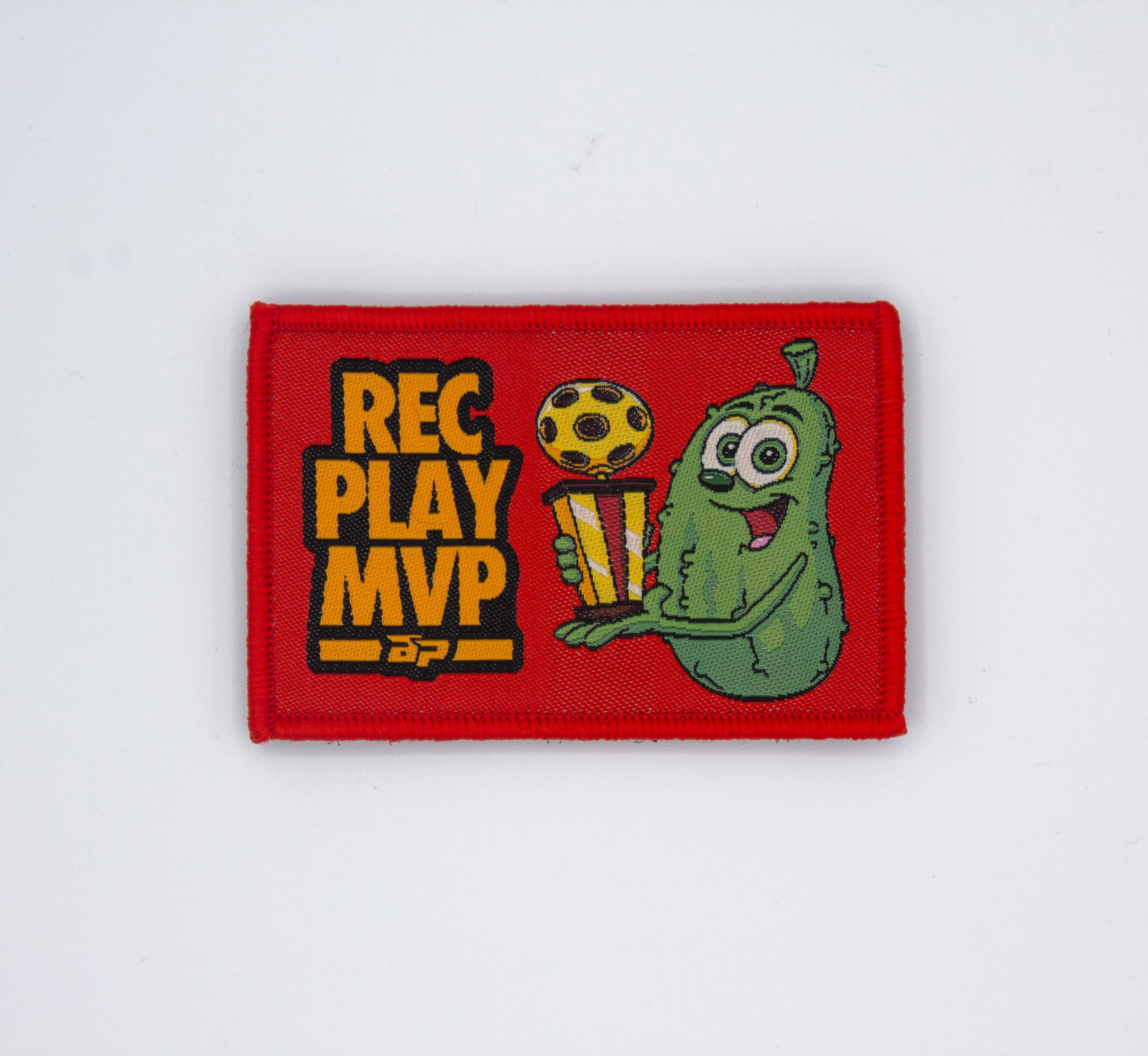 Red rectangular Velcro patch by Bodhi Performance, featuring 'REC PLAY MVP' text and a smiling pickle character with a trophy and soccer ball.