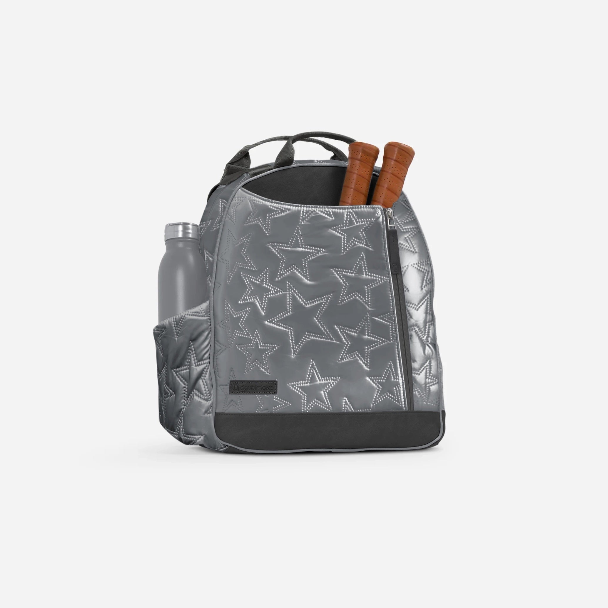 Silver quilted Pickleball Backpack & Tote by Doubletake with a star pattern, holding a water bottle and two paddle handles.
