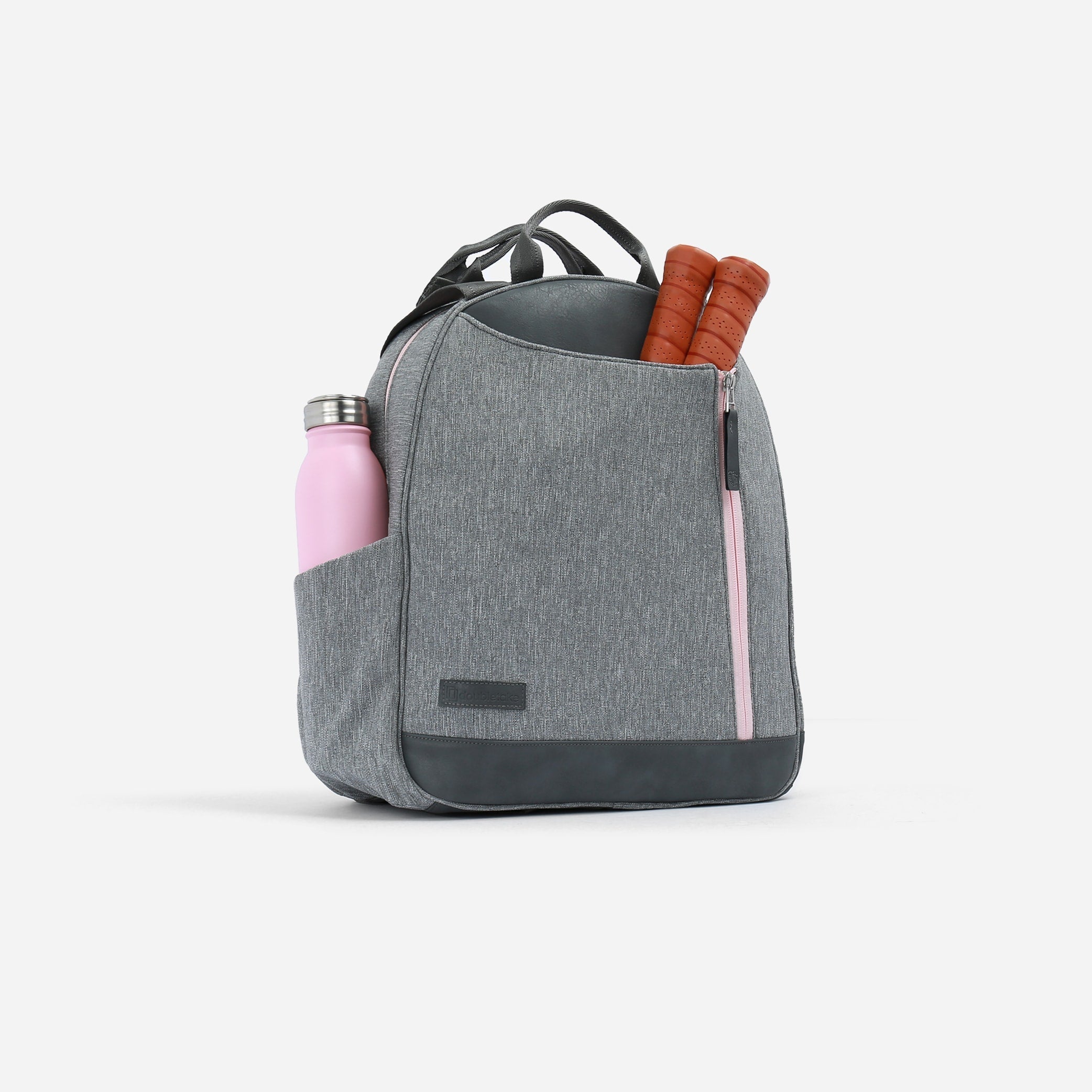 Grey textured Pickleball Backpack & Tote by Doubletake, featuring pink zippers, a water bottle, and two pickleball paddles.