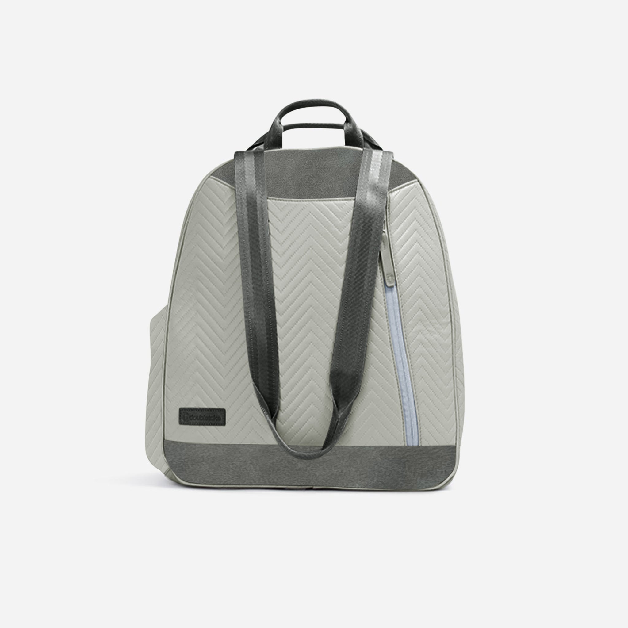 Light grey chevron quilted pickleball backpack by Doubletake with dark grey handle, back straps, and base, featuring a blue zipper.