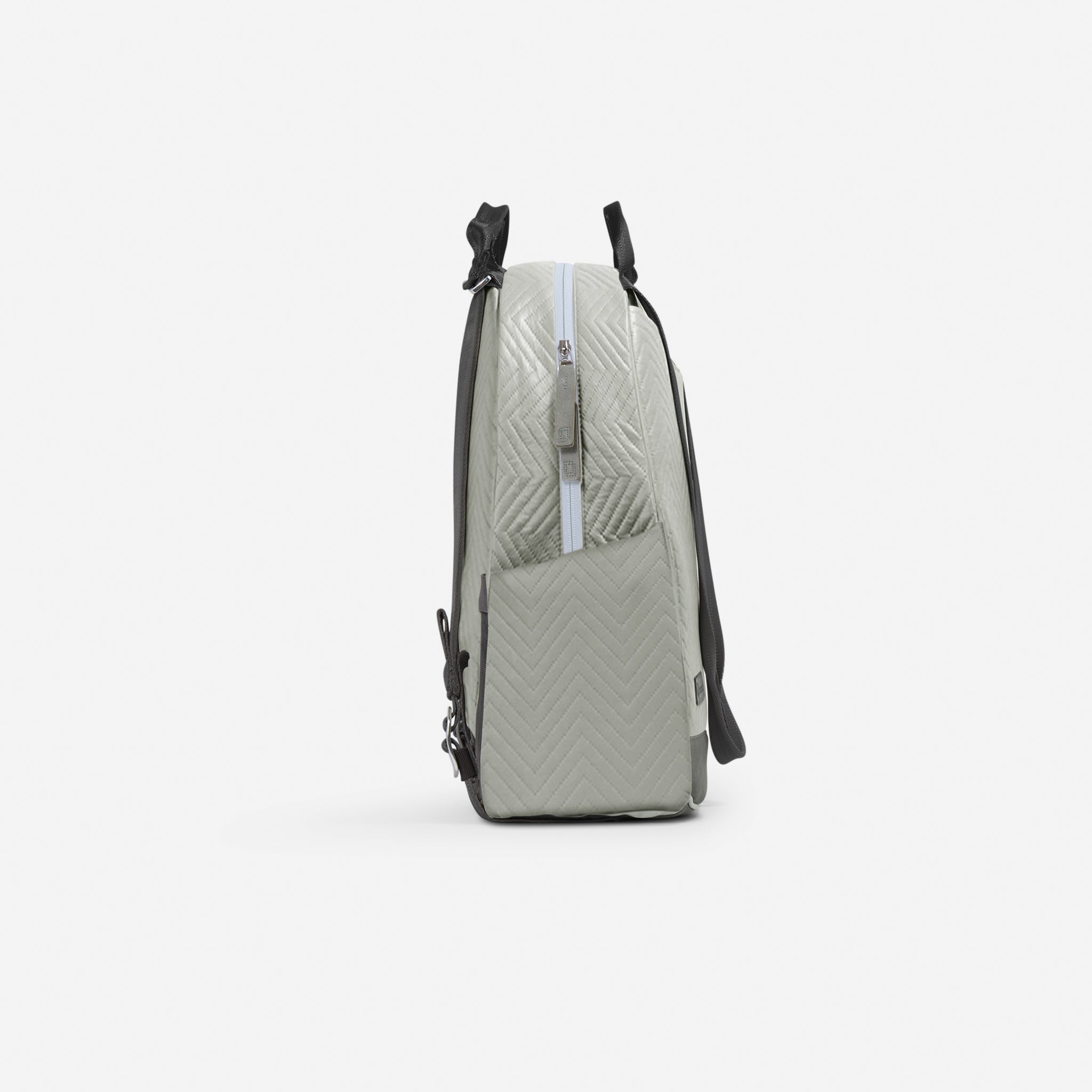 Sage green quilted pickleball backpack and tote by Doubletake, with chevron pattern, front zipper, and top handles, side view.