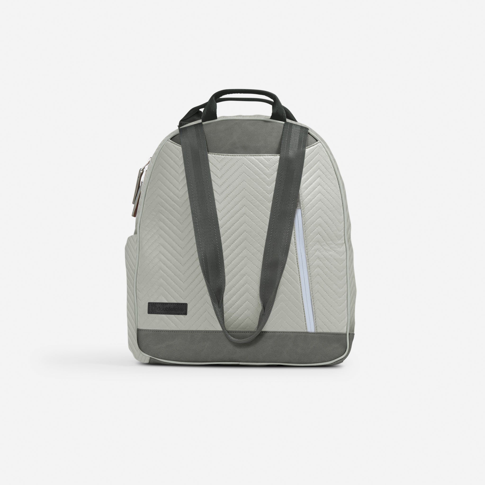 Light grey and dark grey tennis backpack by Doubletake with a chevron quilted pattern and top handles, shown from the back.