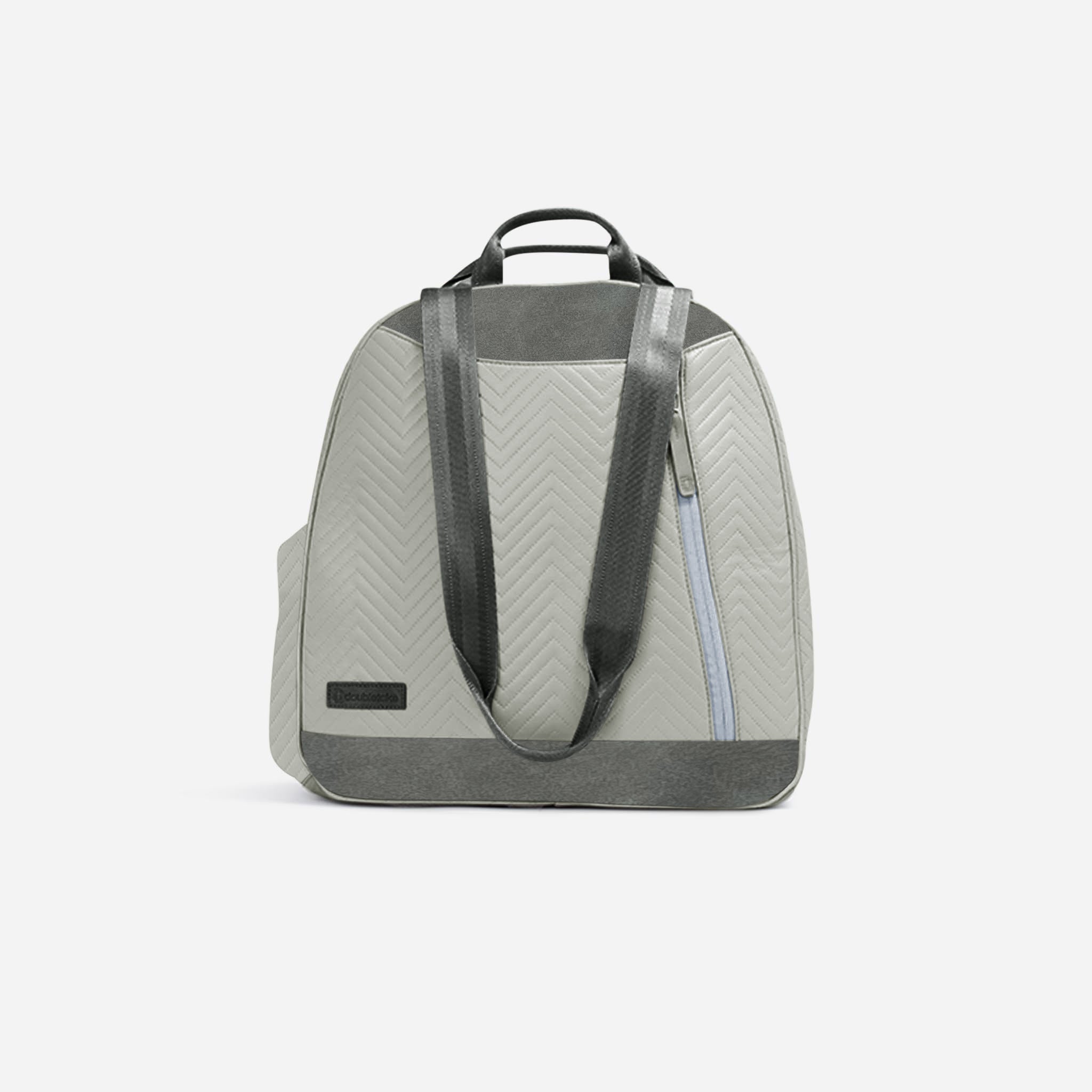 Light grey quilted tennis backpack & tote by Doubletake with dark grey trim, chevron pattern, top handle, and light blue zipper detail.