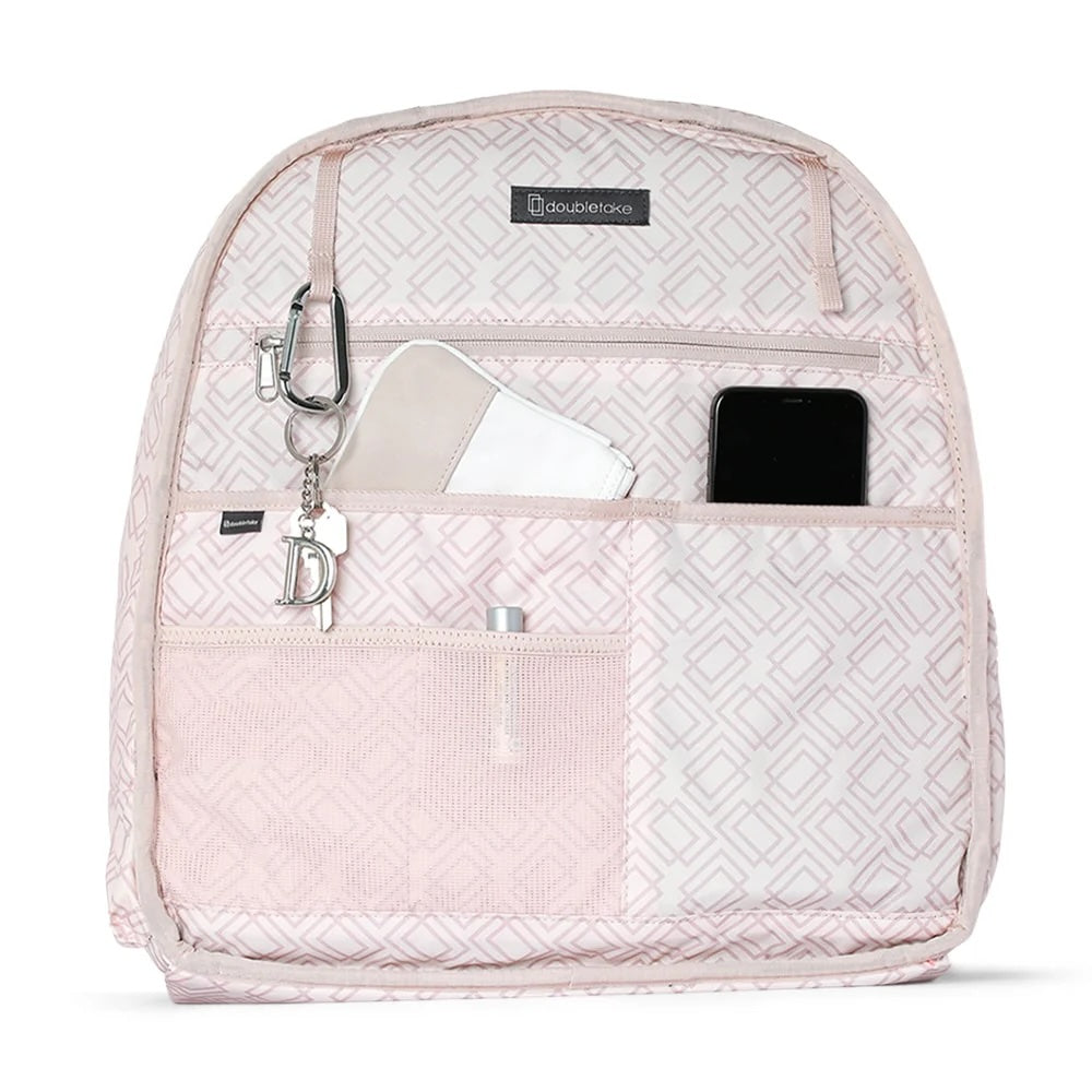 Light pink geometric tennis backpack by Doubletake, open to reveal organized pockets holding keys, a wallet, and a phone.