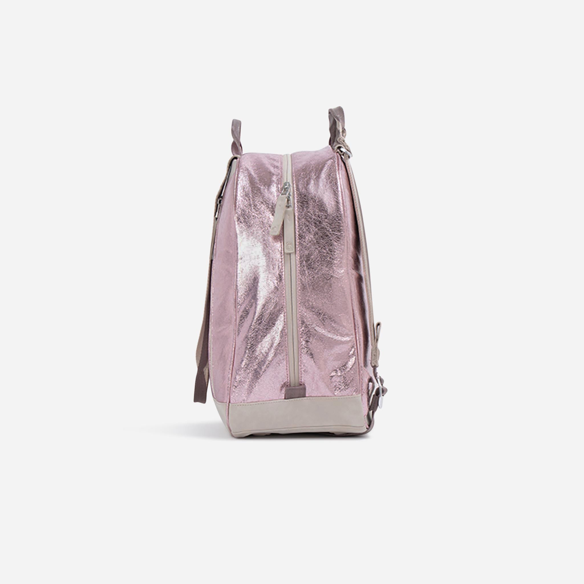 Pink metallic tennis backpack by Doubletake, side view with crinkled texture, light beige base, and a front zipper.