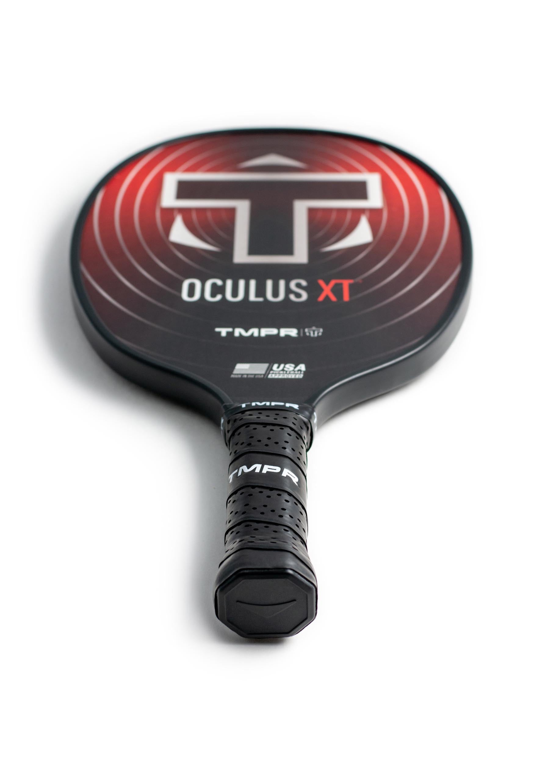 Black Oculus XT pickleball paddle by TMPR Sports with a red face, large 'T' logo, and perforated grip.
