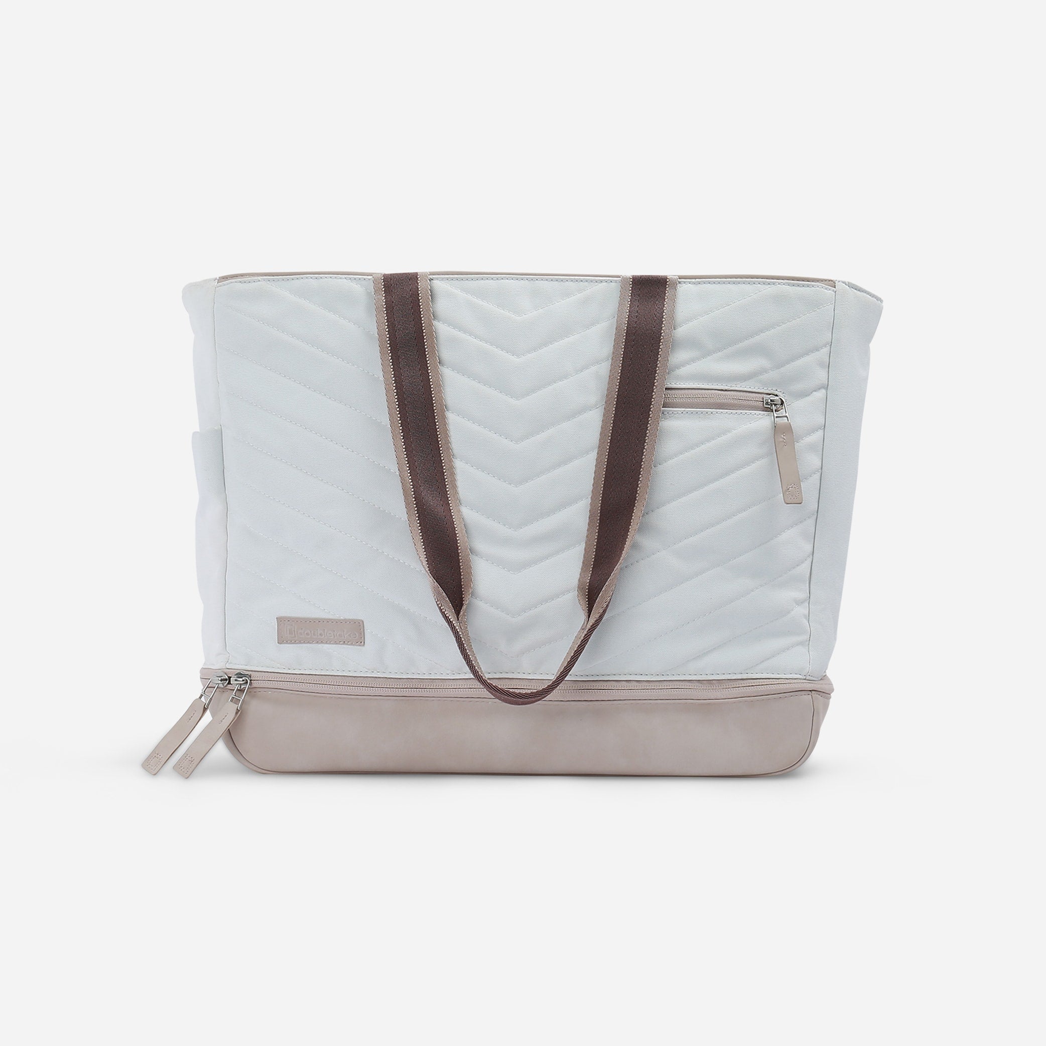Light grey and beige Pickleball Tote by Doubletake with chevron quilting, brown straps, and a zippered bottom compartment.