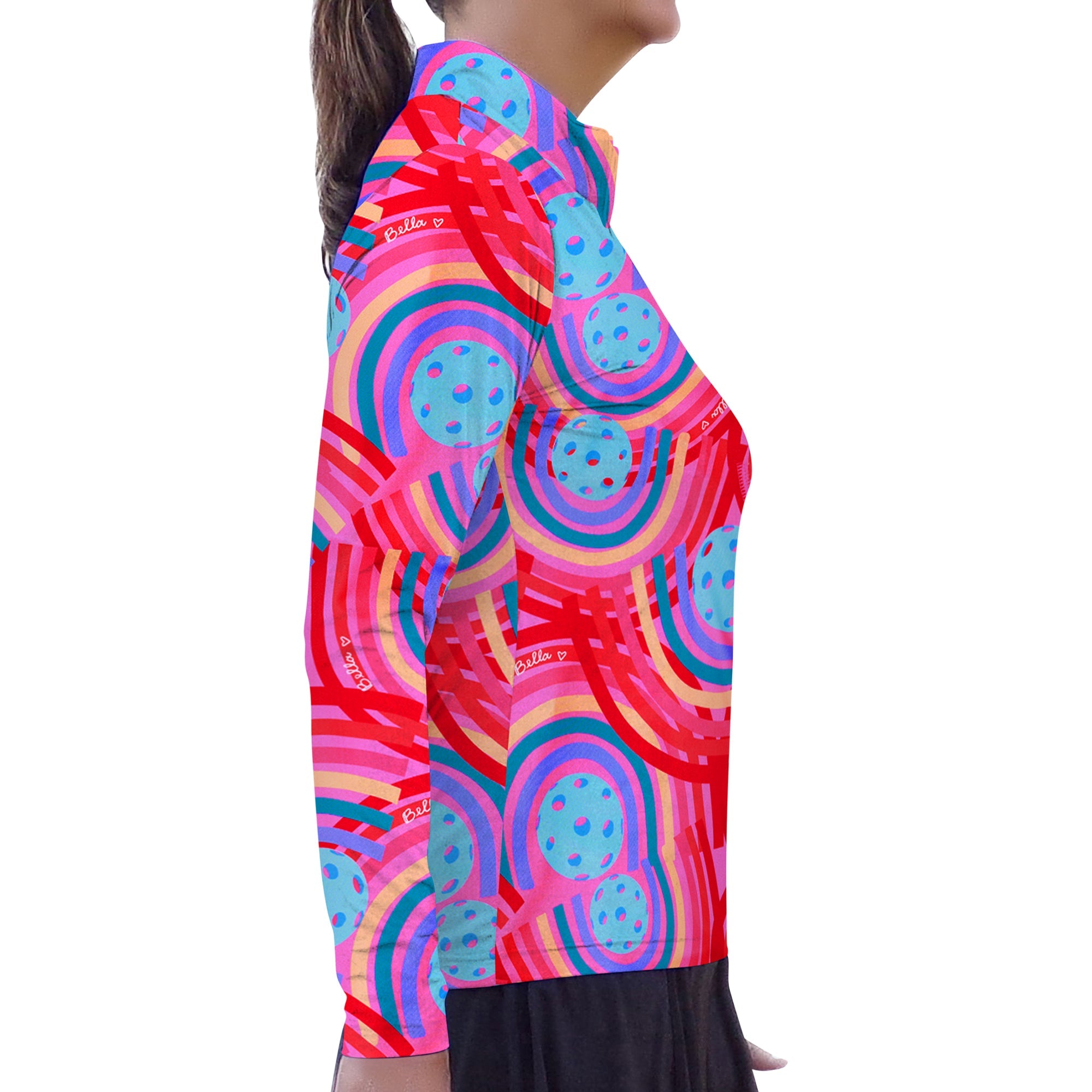 Vibrant multi-colored 1/4 Zip Long Sleeve Pullover by Pickleball Bella, with rainbow stripe and pickleball circle pattern, side view.
