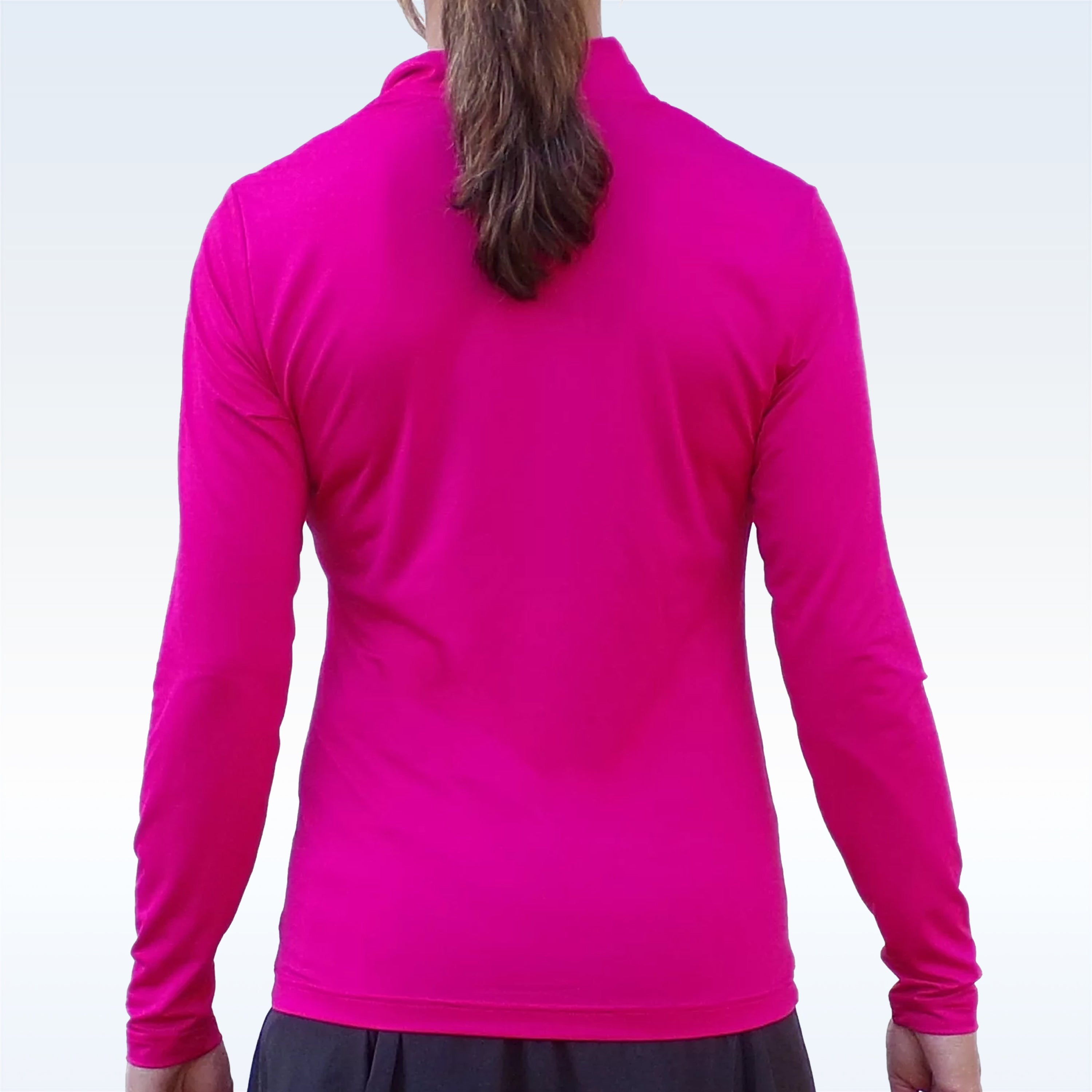 Pink 1/4 Zip Long Sleeve Pullover by Pickleball Bella, back view on a model with a brown ponytail wearing a dark skirt.