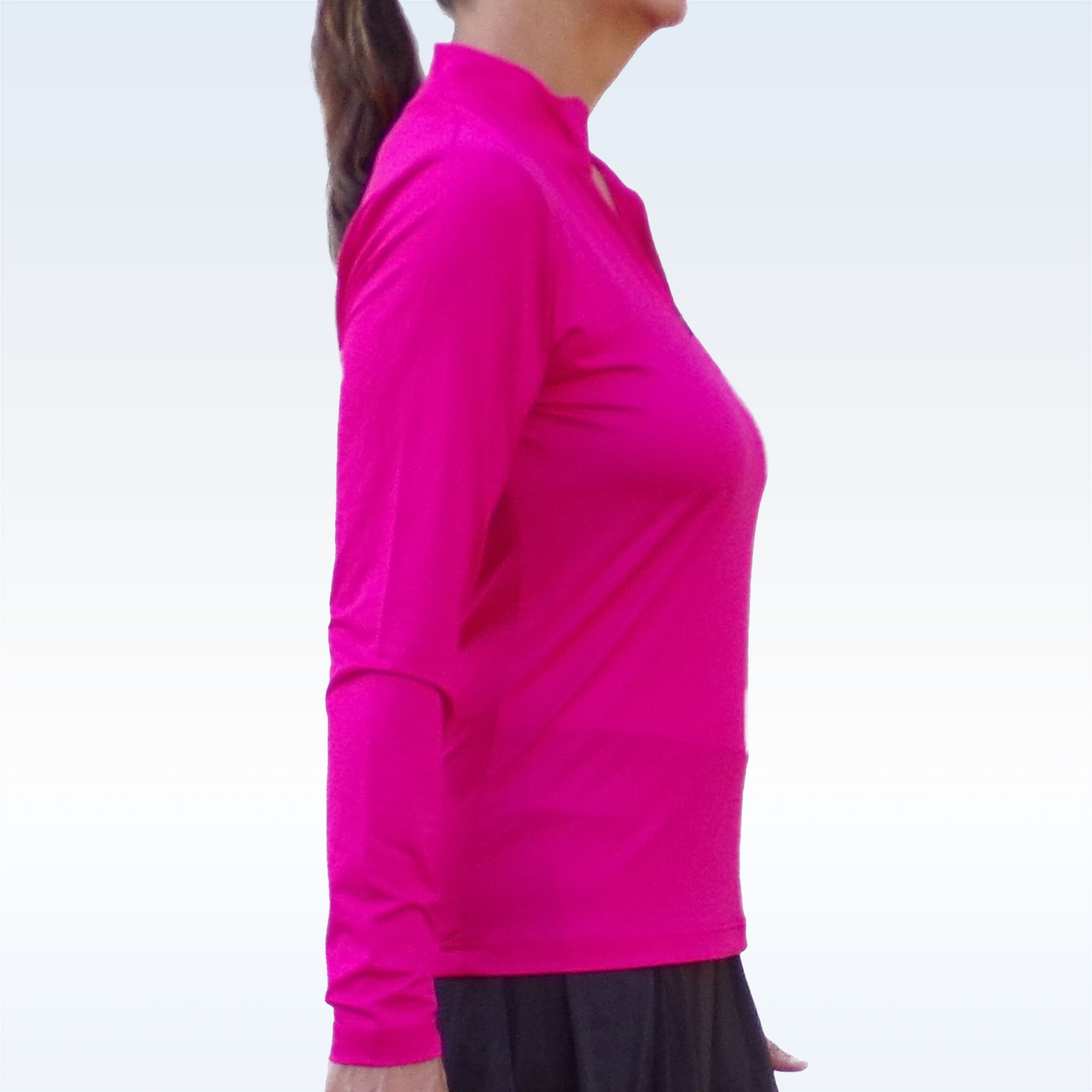 Pink 1/4 Zip Long Sleeve Pullover by Pickleball Bella with a mock neck and zipper, seen from the side on a woman in a black skirt.