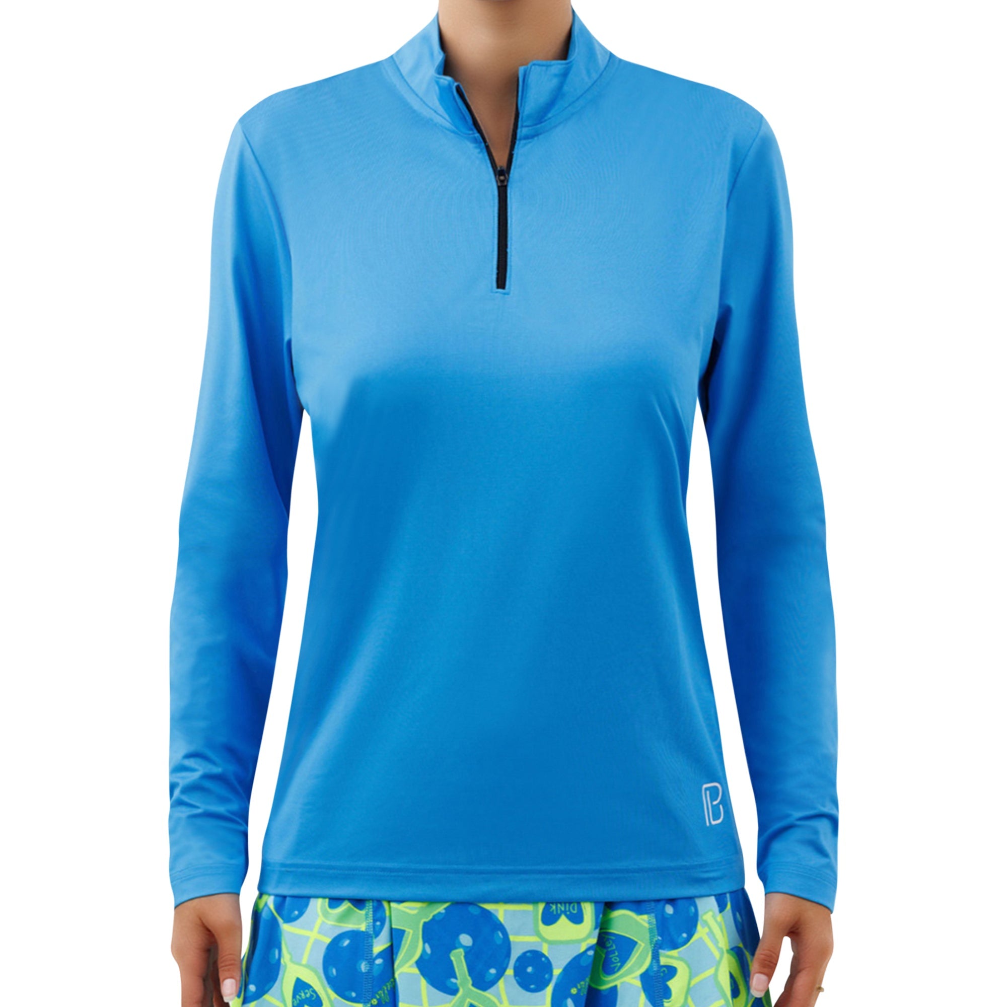 Electric blue long sleeve 1/4 zip pullover by Pickleball Bella, featuring a black zipper, white 'B' logo, and worn with a pickleball-themed skirt.