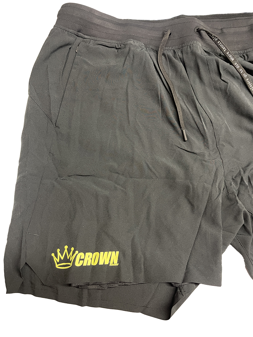Black running shorts with a yellow "CROWN" logo.