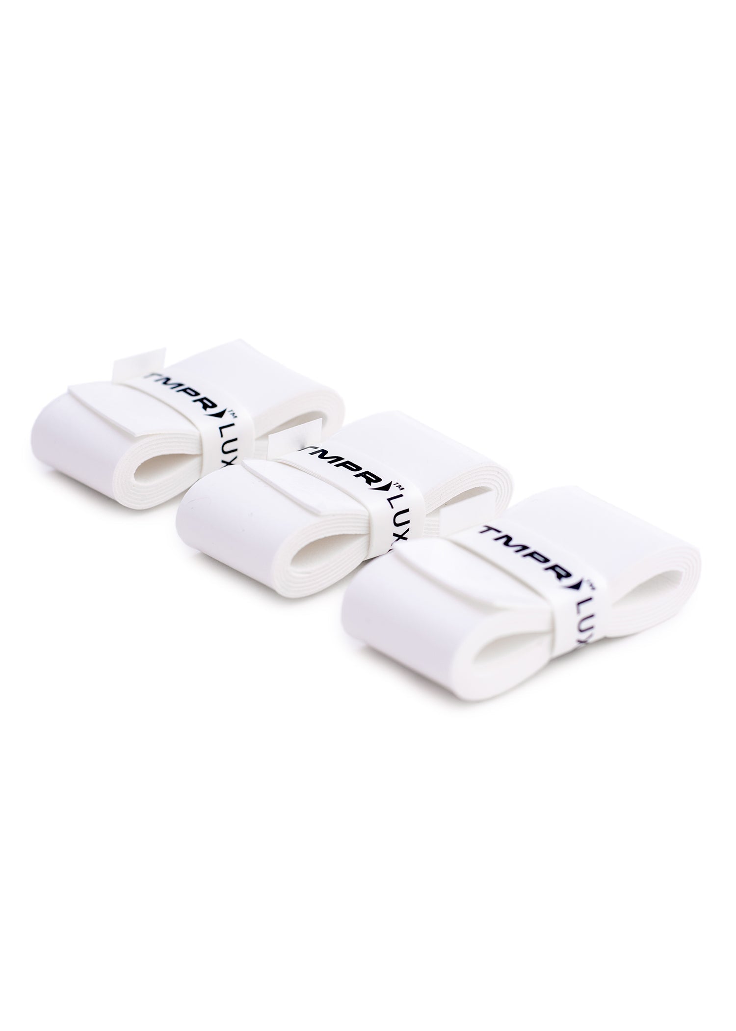 White overgrip by TMPR Sports, four rolled units in a row with "TMPR™ LUX" branded bands.