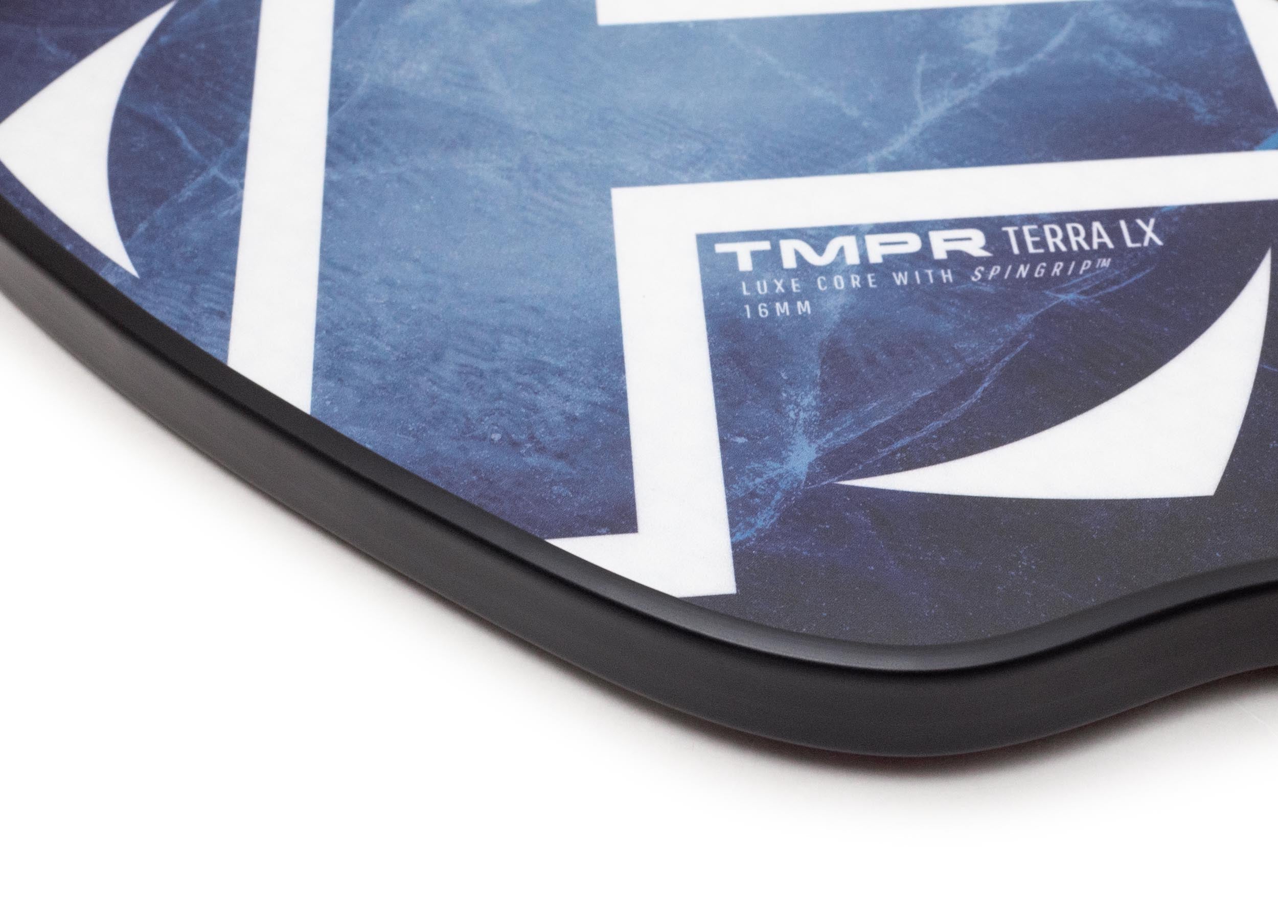 Pickleball paddle with blue Indigo Ice pattern by TMPR Sports, featuring white graphics of 'TMPR TERRA LX' and a black edge.