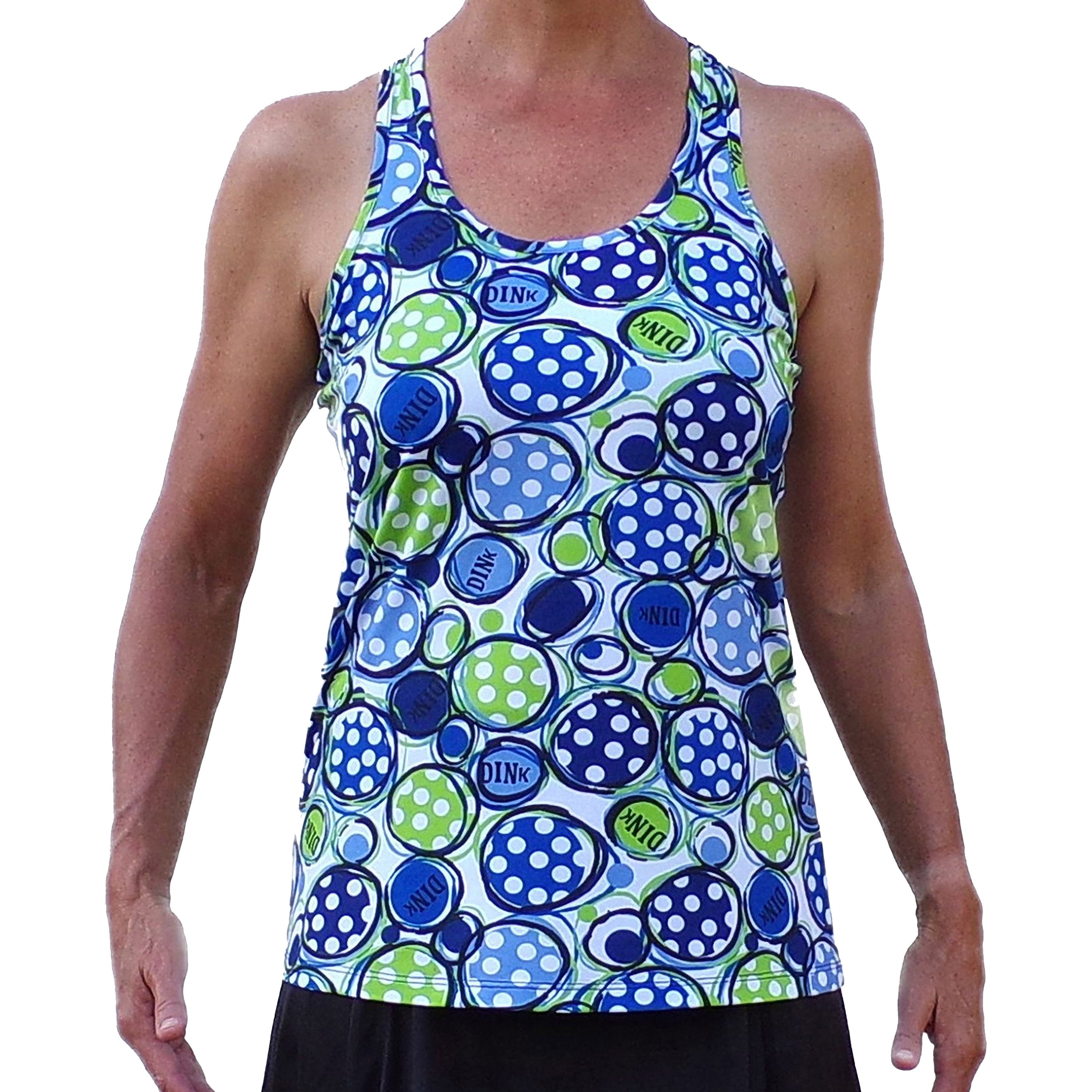Racerback tank with blue and green polka dot circles by Pickleball Bella, featuring 'DINK' text, worn with a black skirt.
