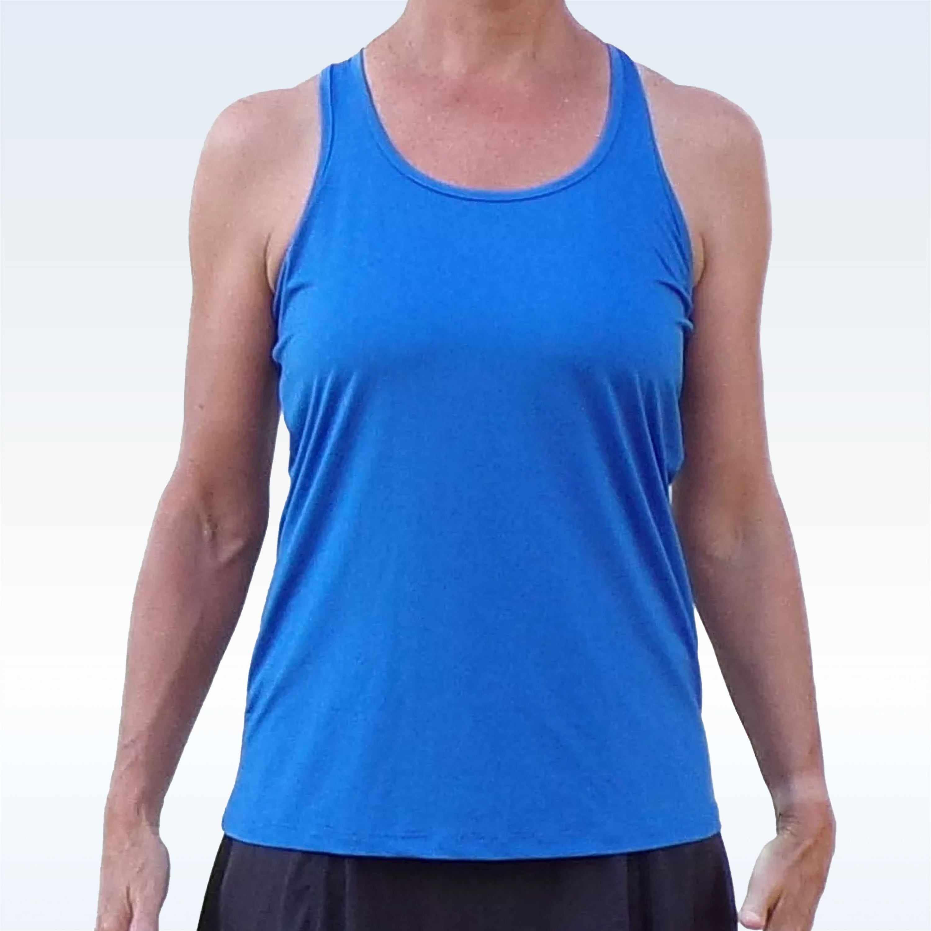 Royal blue racerback tank by Pickleball Bella with a scoop neck, worn with black shorts.