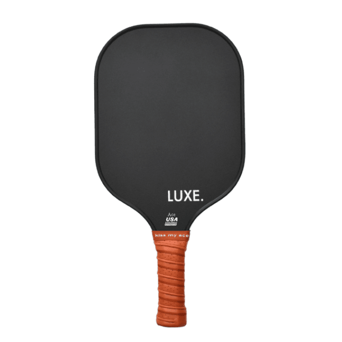 Black pickleball paddle with orange grip.