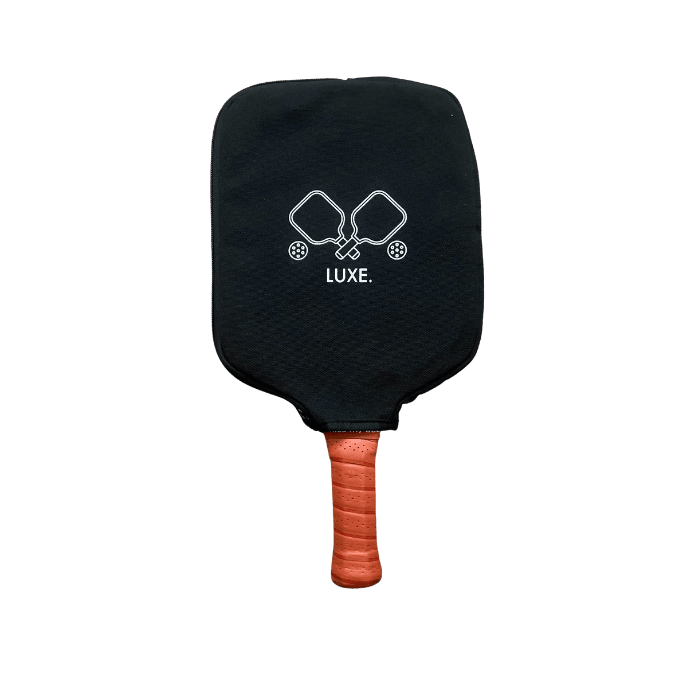 Pickleball paddle in black case, orange grip.