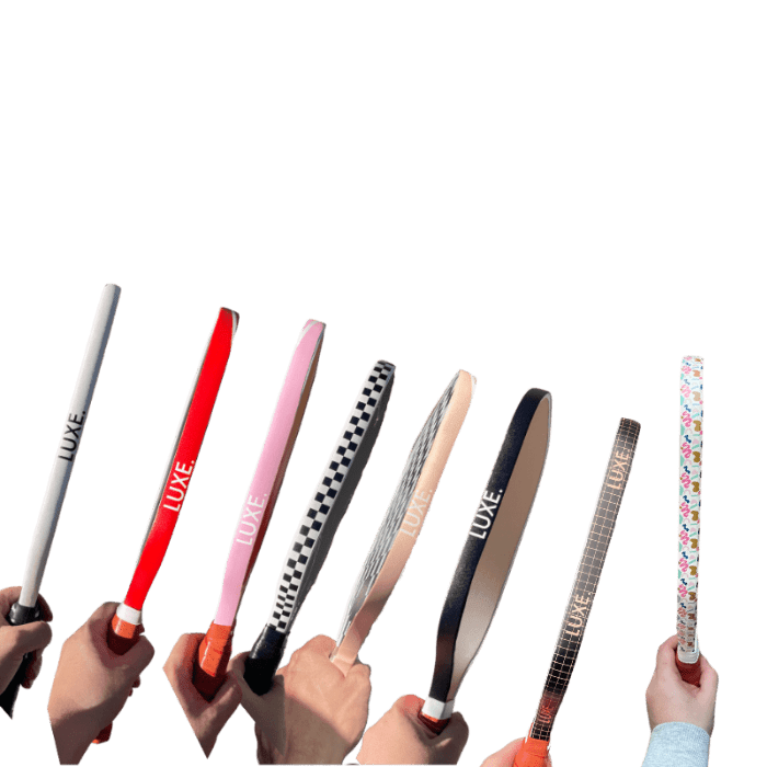 Group of people holding different colorful paddles.