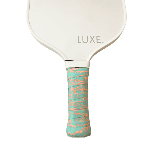 White pickleball paddle with a teal and orange handle.
