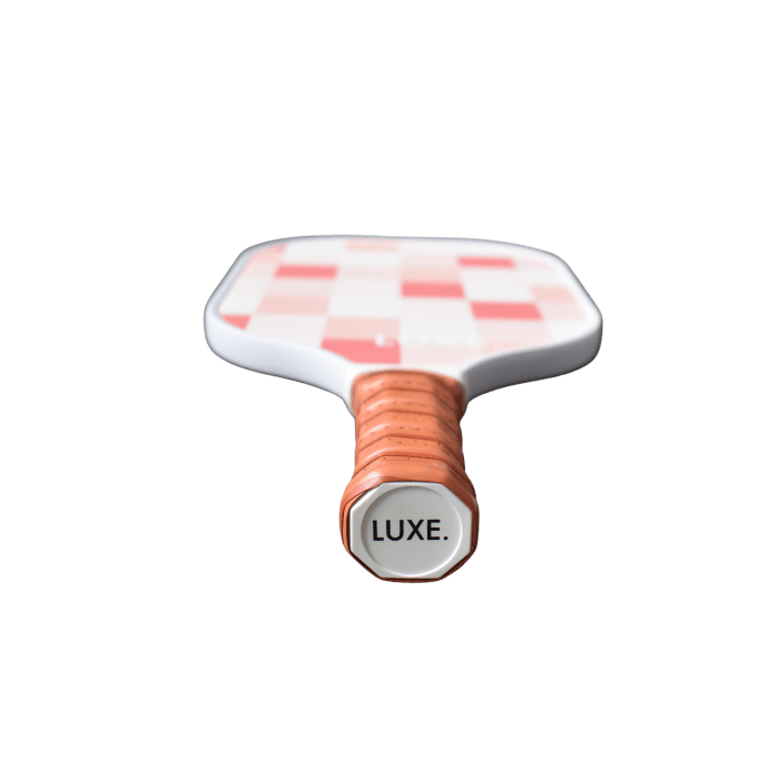 Checkerboard pickleball paddle with tan wrapped handle.