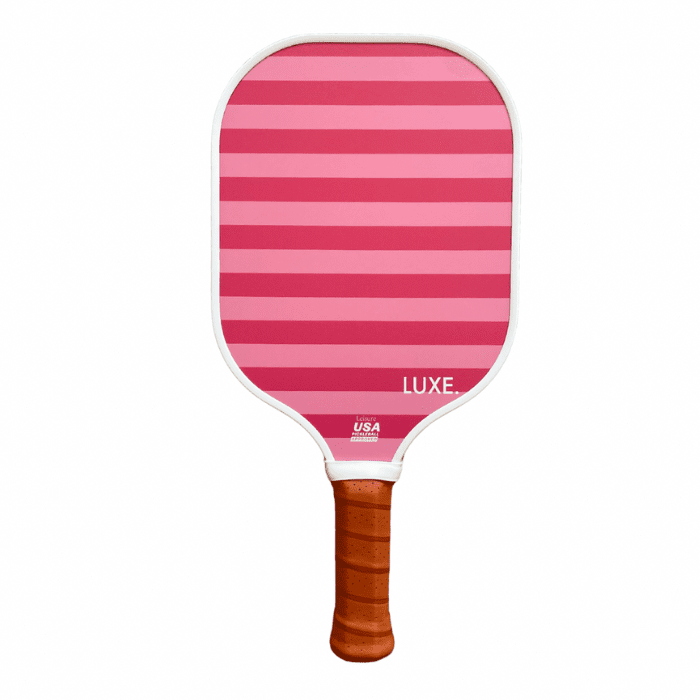 Pink and dark pink striped pickleball paddle by LUXE Pickleball with white trim, brown handle, and USA Pickleball approved stamp.