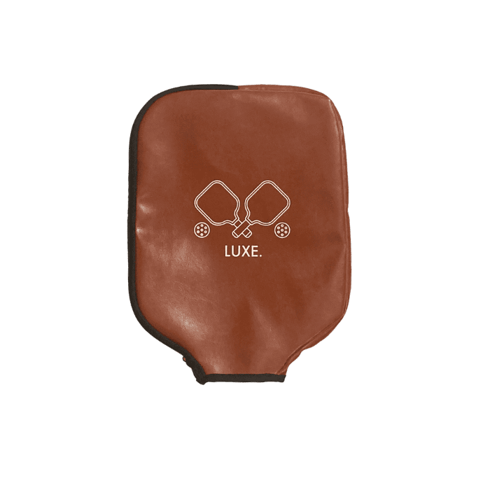 Brown leather paddle cover with black trim and white logo.