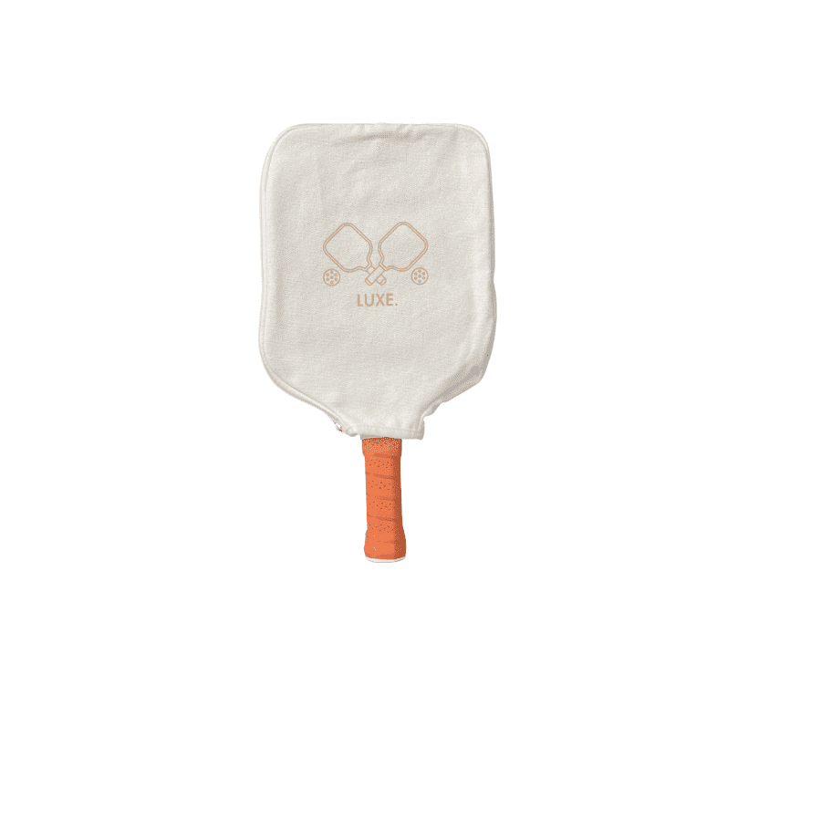 Pickleball paddle with a beige protective cover and orange grip.