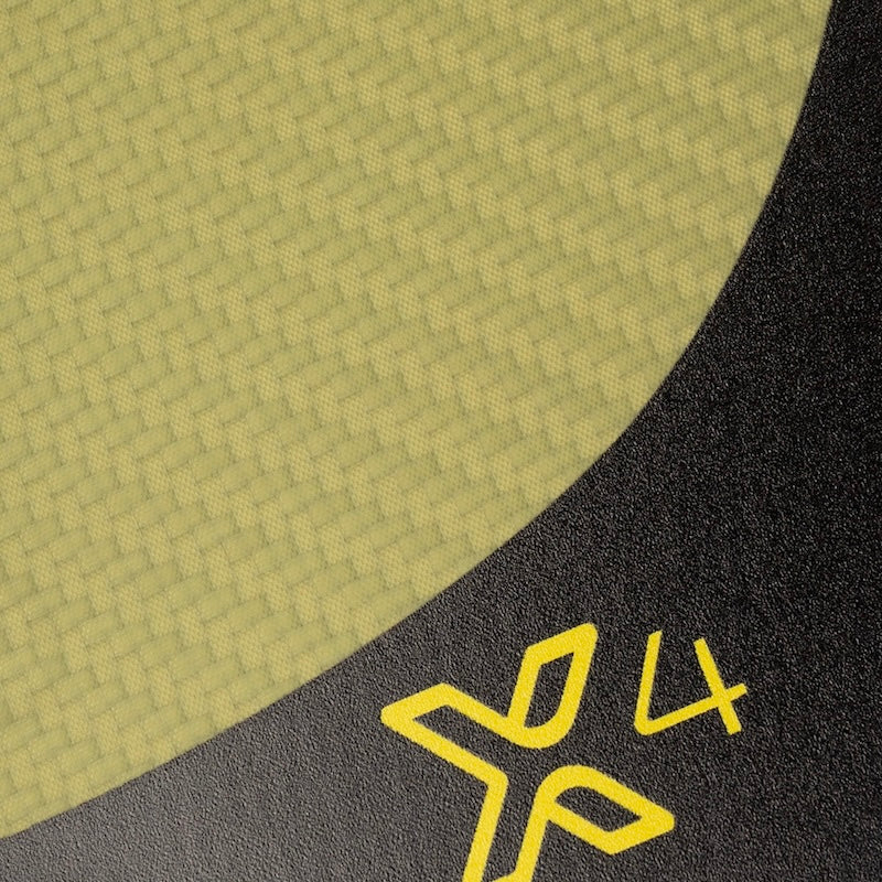 Close-up of a yellow textured surface and a black surface with yellow "X4" logo.