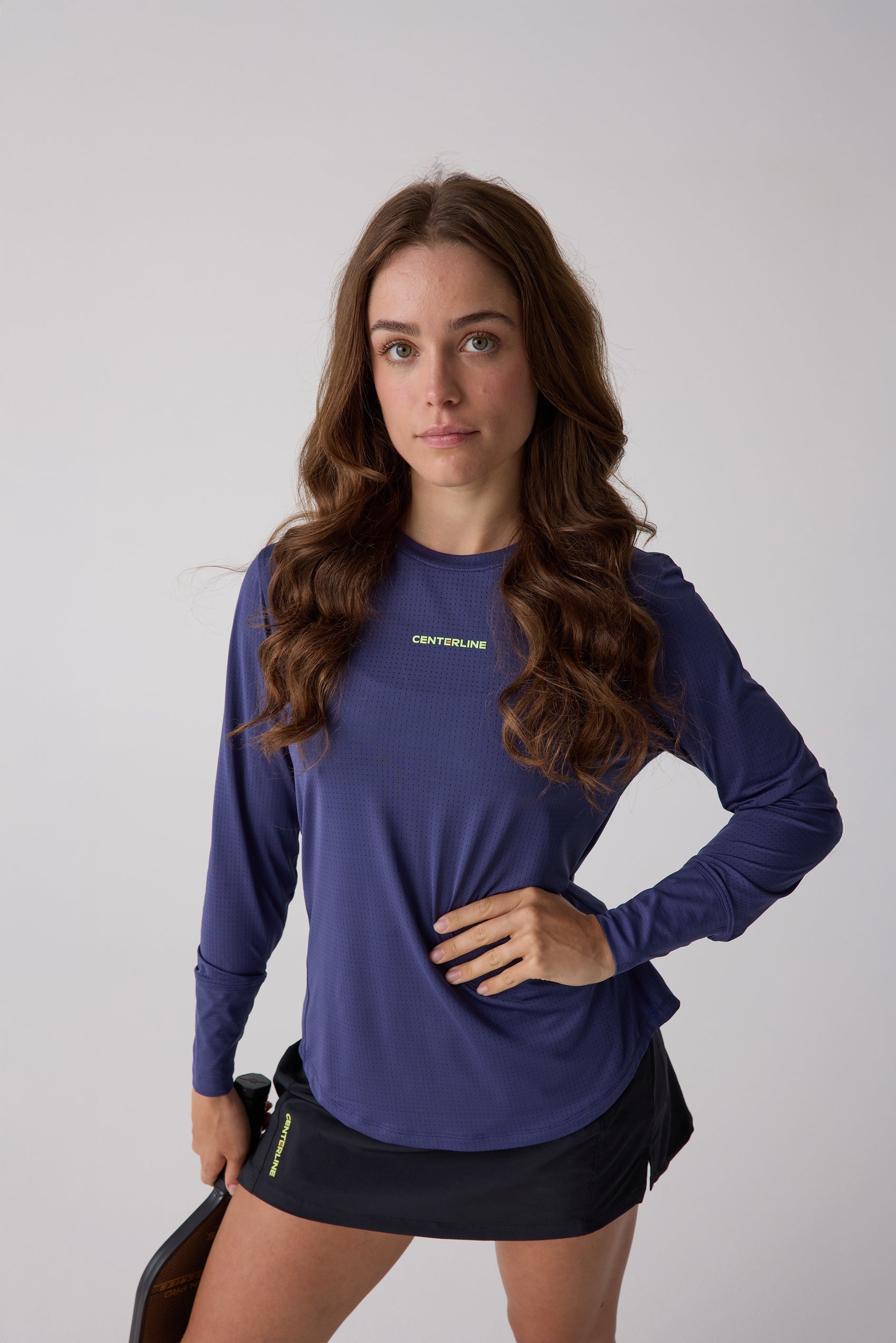 Women's AirLite long sleeve shirt in navy blue with micro-perforations by Centerline Athletics, featuring 'CENTERLINE' text and a woman holding a paddle.