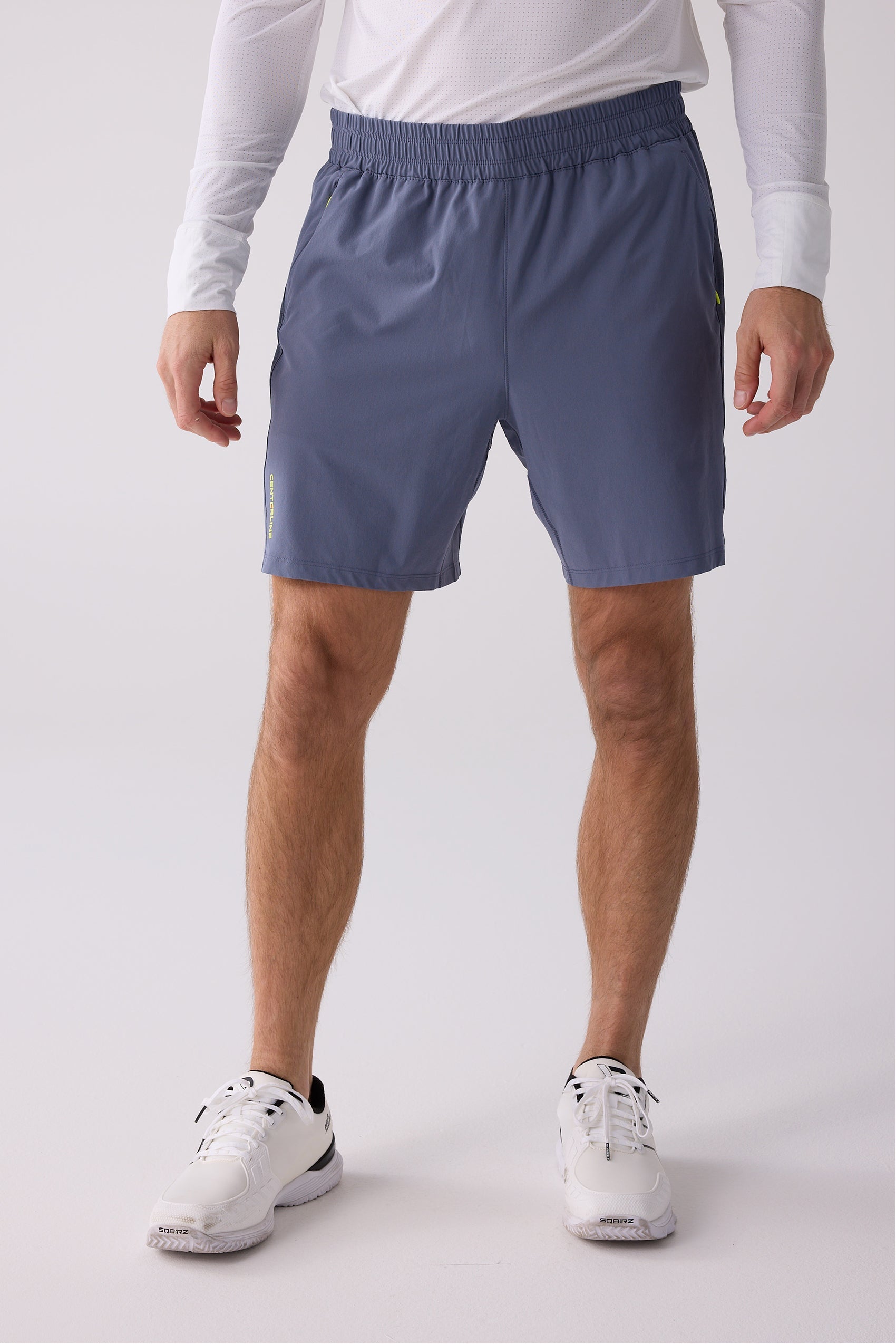 Men's slate blue AirLite 7" Unlined Shorts by Centerline Athletics, with elastic waistband, side pockets, and brand text on left leg.