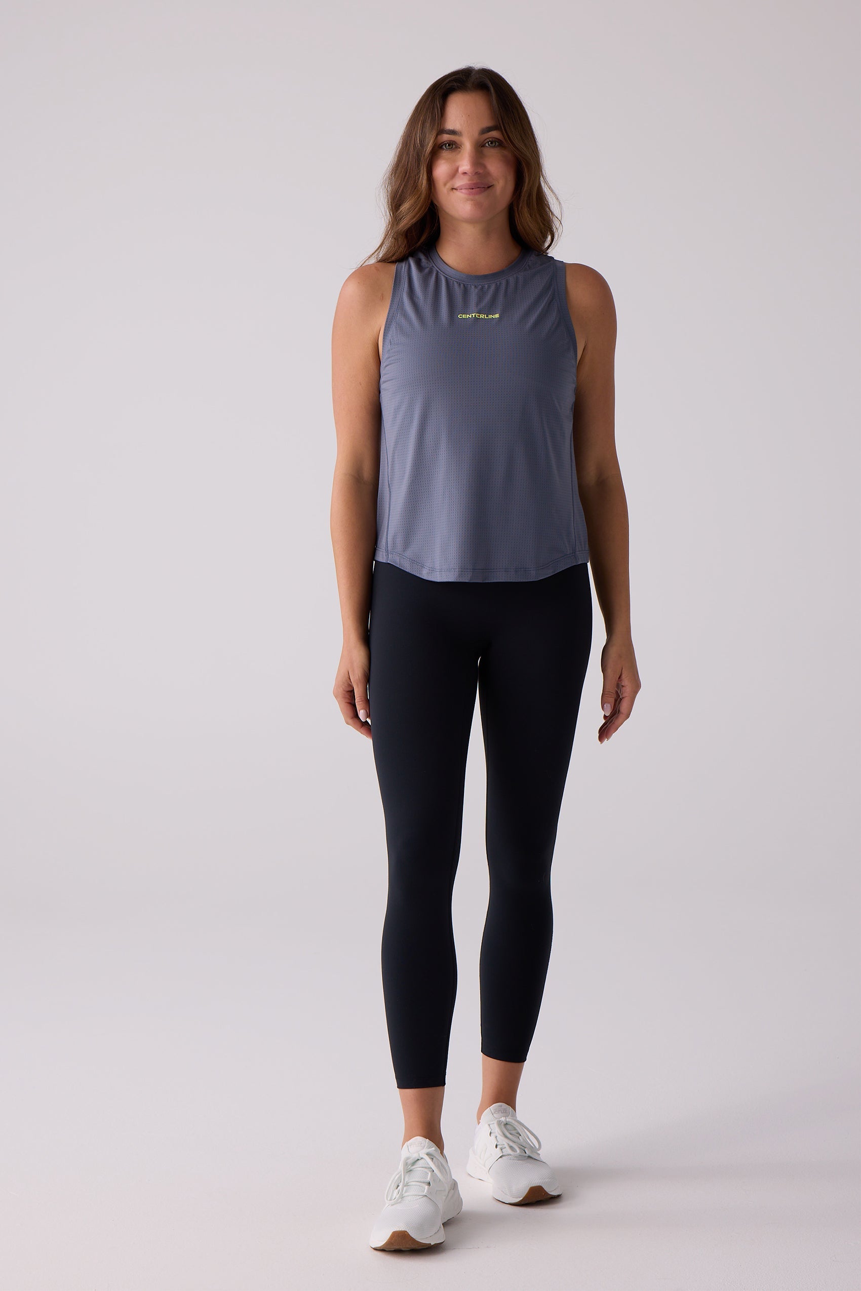 Dark blue-grey Women's AirLite tank by Centerline Athletics, with a yellow CENTERLINE logo and perforated texture.