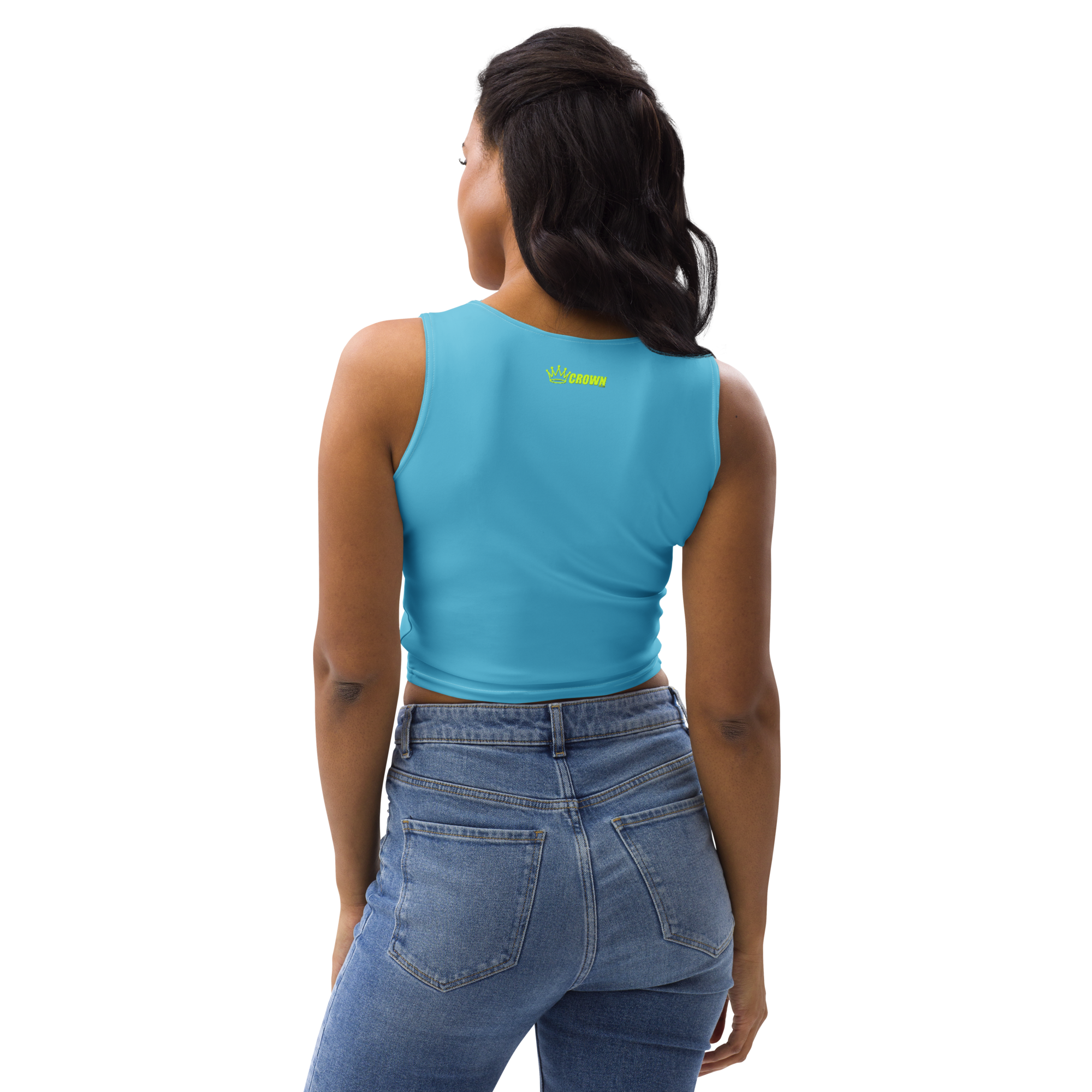 A woman with her back to the camera wearing a blue crop top and blue jeans.