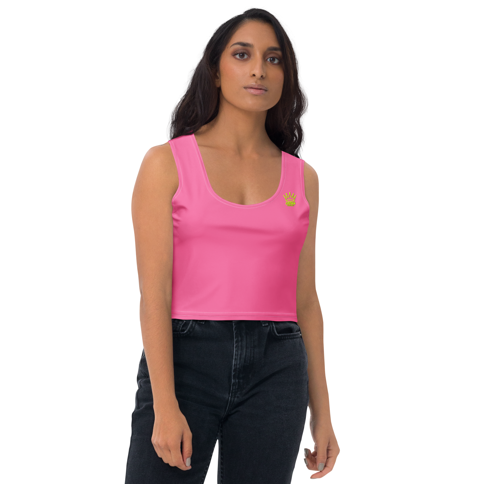 Woman in a pink crop top and dark jeans.