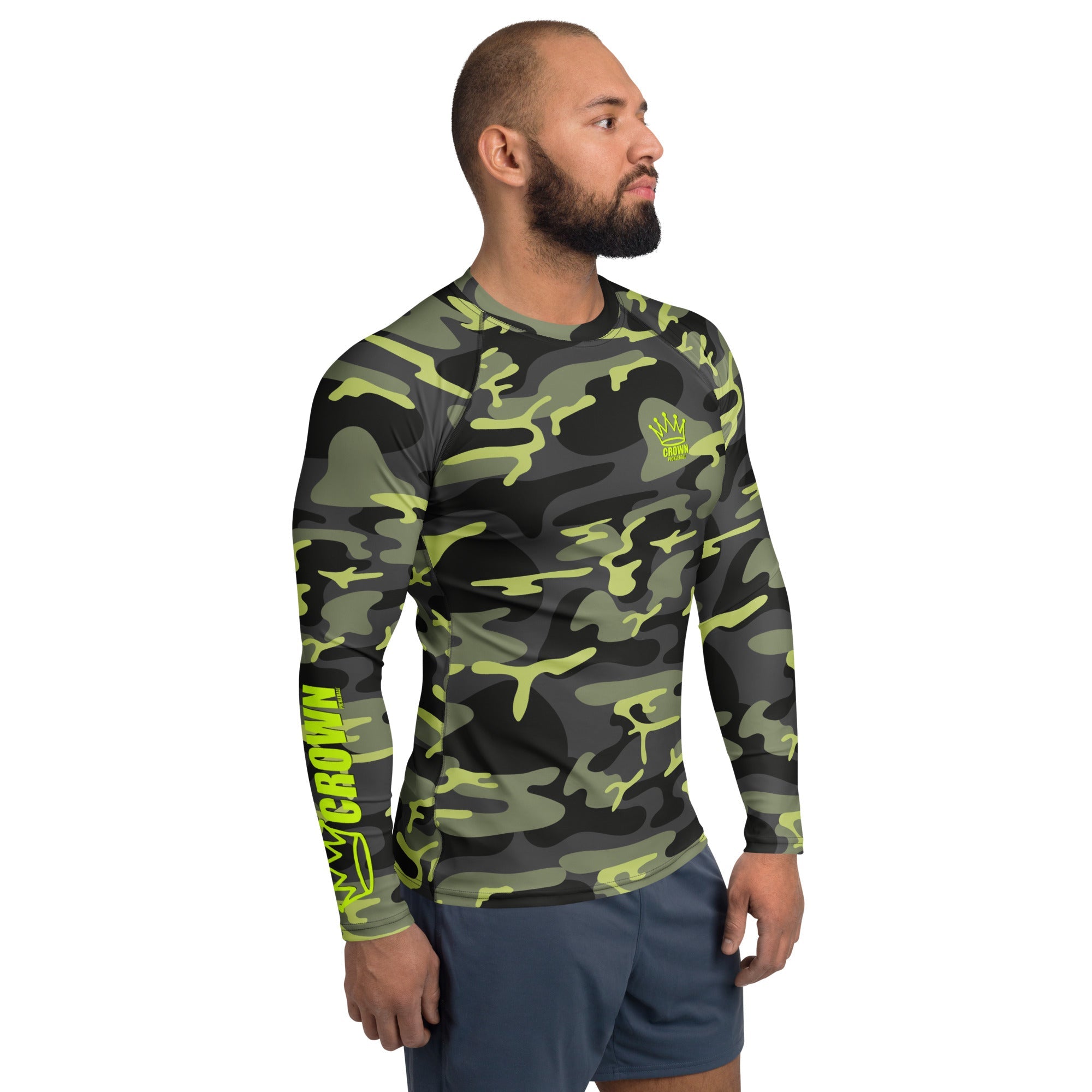Man wearing a camo long-sleeve shirt and blue shorts.
