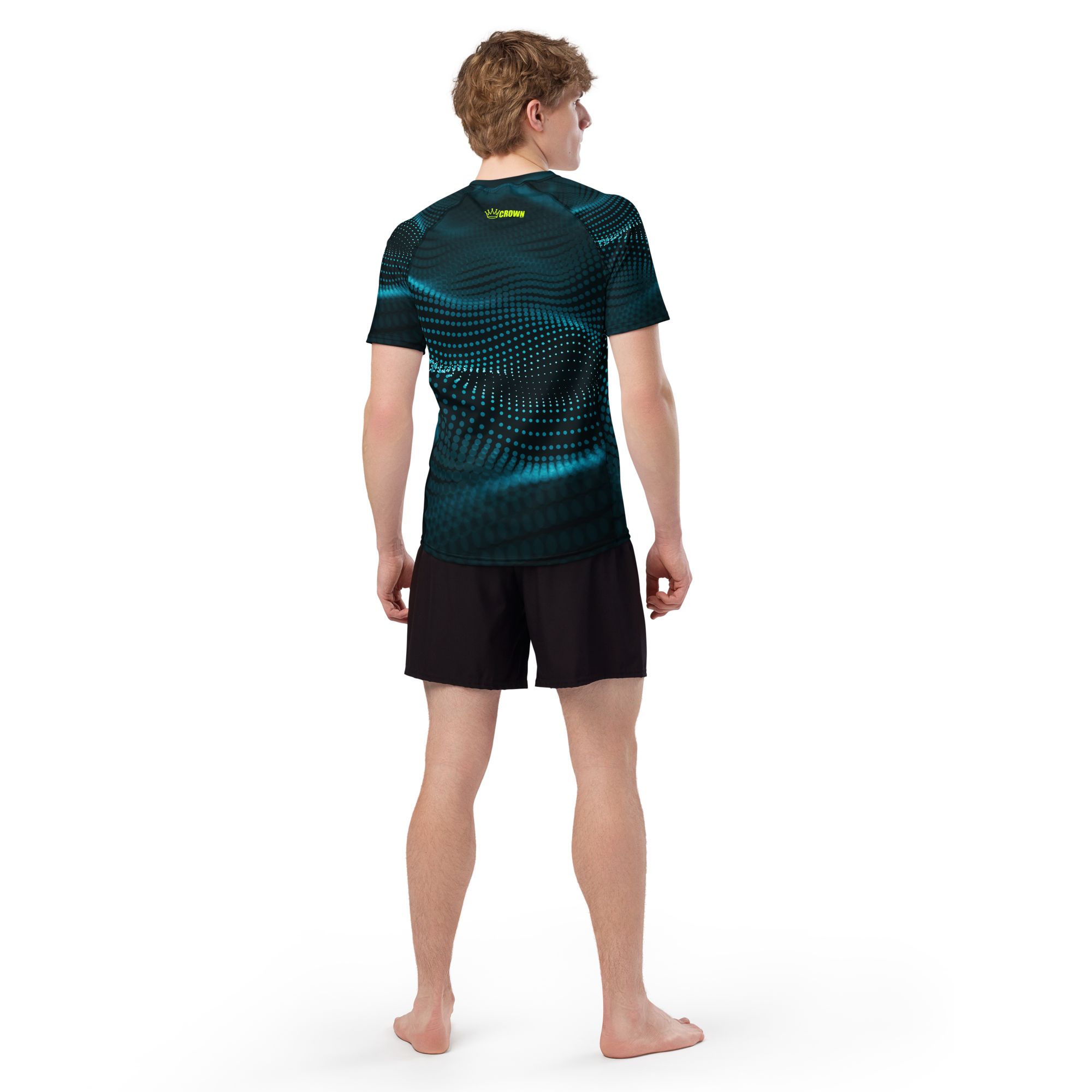 Man in a blue and black patterned shirt with black shorts, back view.