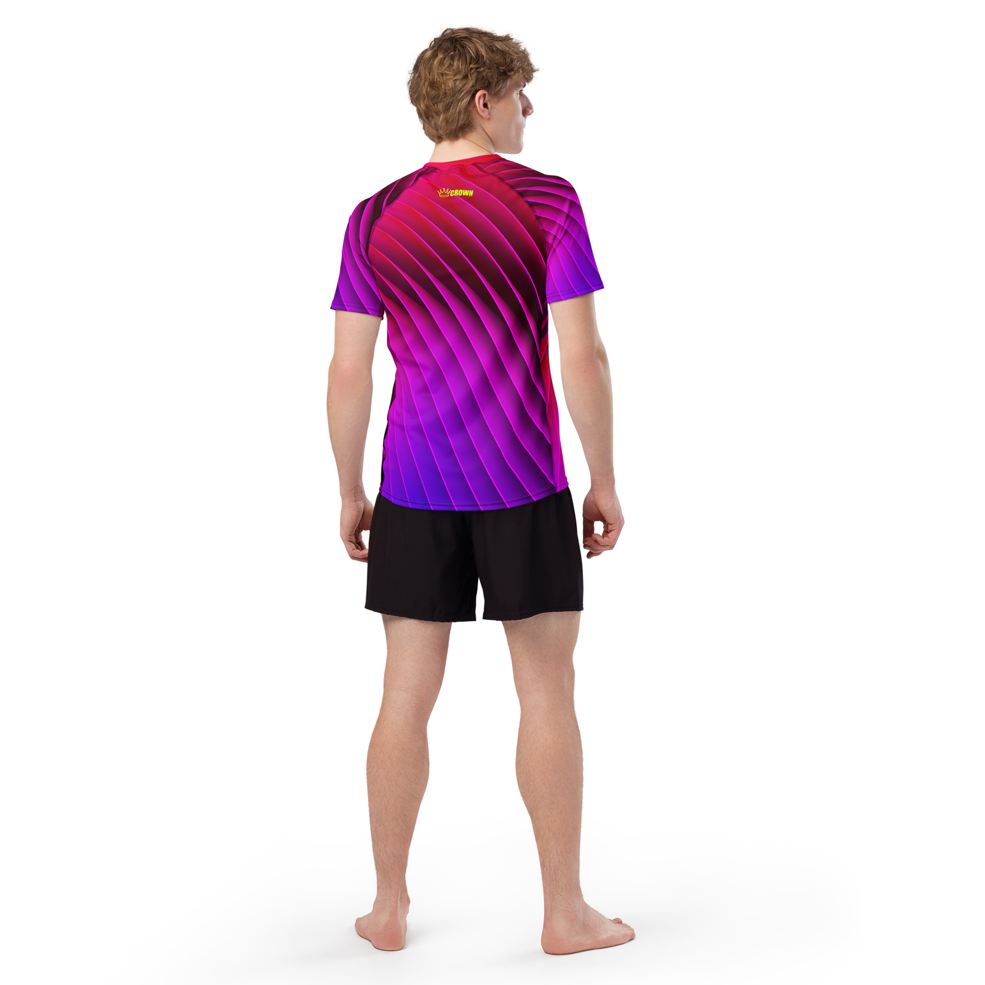Man from the back in a purple and red shirt and black shorts.